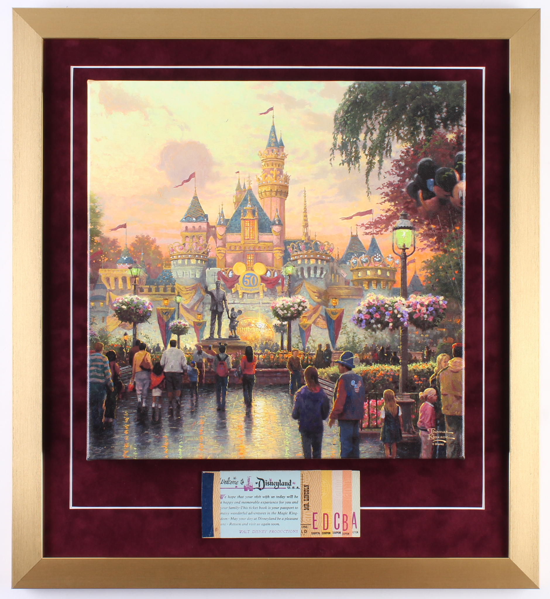 Thomas Kinkade 50th Anniversary "Disneyland" 20x22 Custom Framed Canvas on Wood Display with Full Vintage Ticket Book at PristineAuction.com Thomas Kinkade 50th Anniversary "Disneyland" 20x22 Custom Framed Canvas on Wood Display with Full Vintage Ticket Book at PristineAuction.com