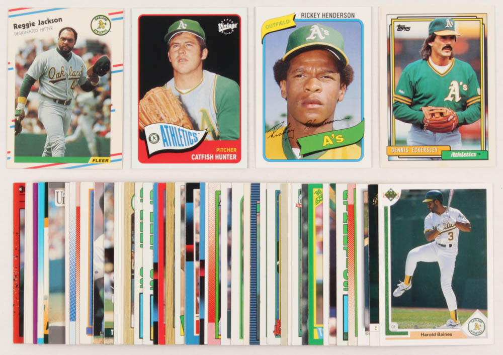 Lot of (50) Oakland A's Baseball Cards with 1988 Fleer #283 Reggie Jackson, 2003 Upper Deck Vintage #21 Catfish Hunter, 2006 Topps Rookie of the Week #21 Rickey Henderson, & 1992 Topps #738 Dennis Eckersley