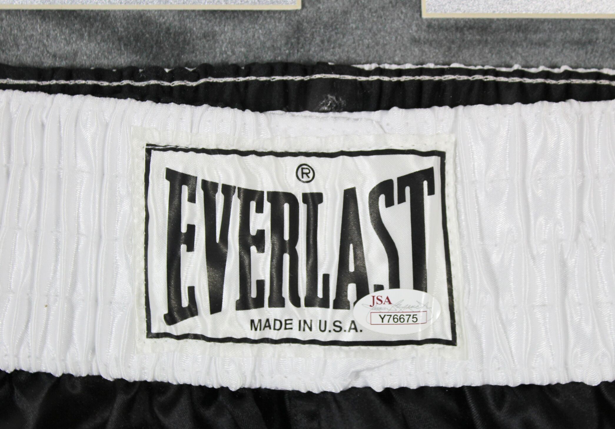 Muhammad Ali Signed 35x42 Custom Framed Boxing Trunks Display Inscribed "AKA Cassius Clay" (JSA LOA) at PristineAuction.com Muhammad Ali Signed 35x42 Custom Framed Boxing Trunks Display Inscribed "AKA Cassius Clay" (JSA LOA) at PristineAuction.com