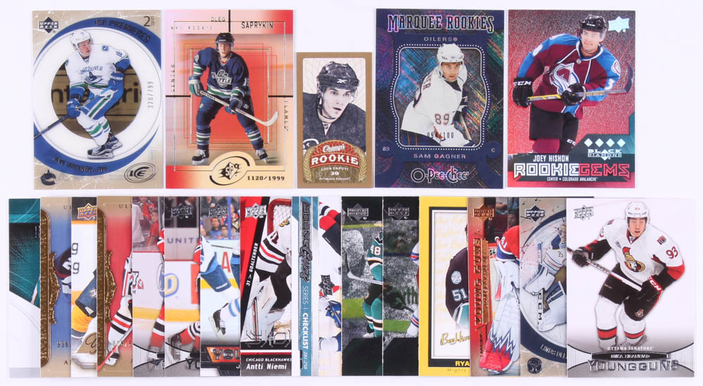Lot of (20) Hockey Rookie Year Cards with 2009-10 Upper Deck Champ's Mini Green Backs #150 Luca Caputi, 2007-08 O-Pee-Chee Micromotion Black #540 Sam Gagner, 2014-15 Black Diamond Ruby #244 Joey Hishon, 1999-00 SPx #172 Oleg Saprykin RC