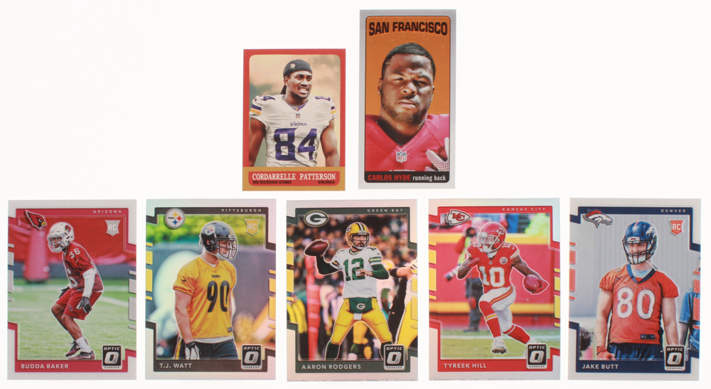Lot of (7) Assorted Football Cards with 2017 Donruss Optic #43 Aaron Rodgers, 2014 Topps 1963 Mini #331 Cordarrelle Patterson, 2014 Topps Chrome 1965 #TB15 Carlos Hyde, 2017 Donruss Optic #144 Jake Butt RC