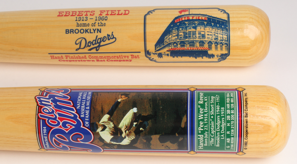 Lot Of (2) Cooperstown Commemorative Baseball Bats With (1) Pee Wee Reese & (1) Ebbets Field at PristineAuction.com Lot Of (2) Cooperstown Commemorative Baseball Bats With (1) Pee Wee Reese & (1) Ebbets Field at PristineAuction.com