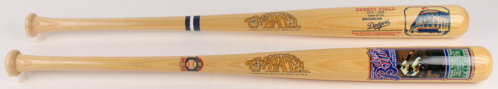 Lot Of (2) Cooperstown Commemorative Baseball Bats With (1) Pee Wee Reese & (1) Ebbets Field at PristineAuction.com Lot Of (2) Cooperstown Commemorative Baseball Bats With (1) Pee Wee Reese & (1) Ebbets Field at PristineAuction.com