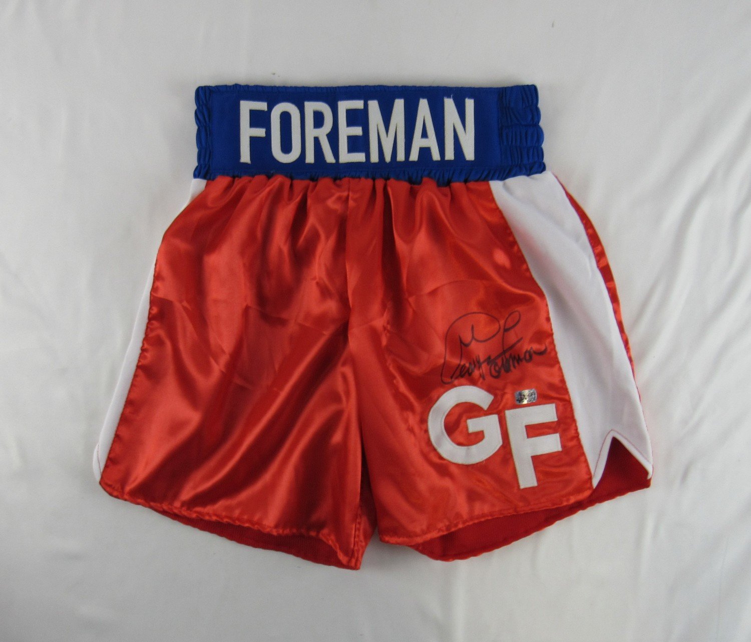 George Foreman Signed Boxing Trunks (Foreman Hologram) at PristineAuction.com George Foreman Signed Boxing Trunks (Foreman Hologram) at PristineAuction.com