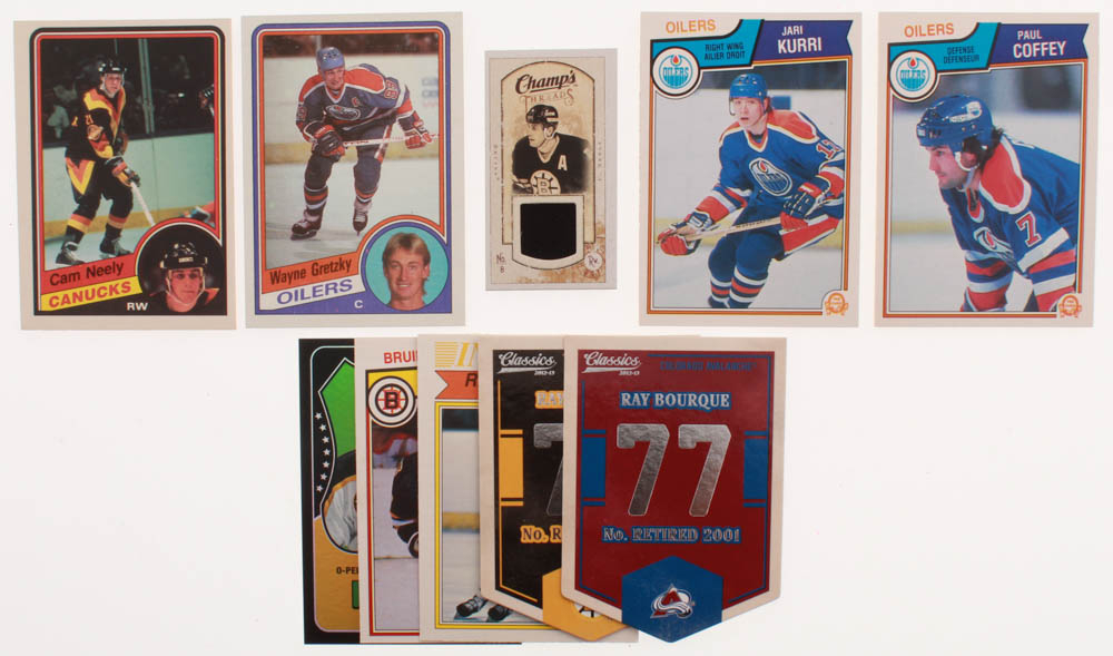 Lot of (10) Hockey Cards with 1984-85 Topps #51 Wayne Gretzky, 1984-85 O-Pee-Chee #327 Cam Neely RC, 1983-84 O-Pee-Chee #25 Paul Coffey, 1983-84 O-Pee-Chee #34 Jari Kurri, 2009-10 Upper Deck Champ's Threads #MTCN Cam Neely