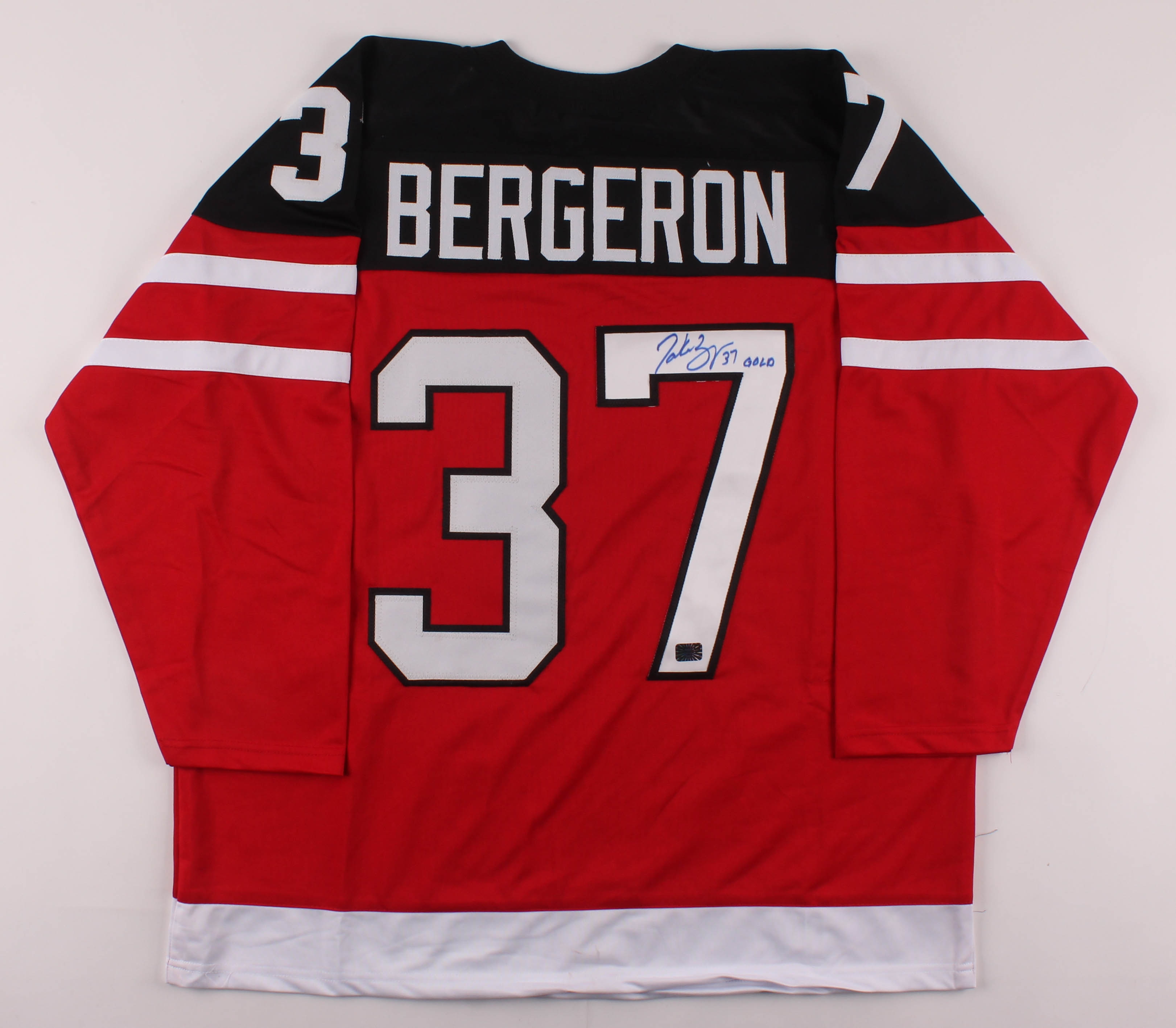 Patrice Bergeron Signed Jersey Inscribed "Gold" (Bergeron COA) at PristineAuction.com Patrice Bergeron Signed Jersey Inscribed "Gold" (Bergeron COA) at PristineAuction.com