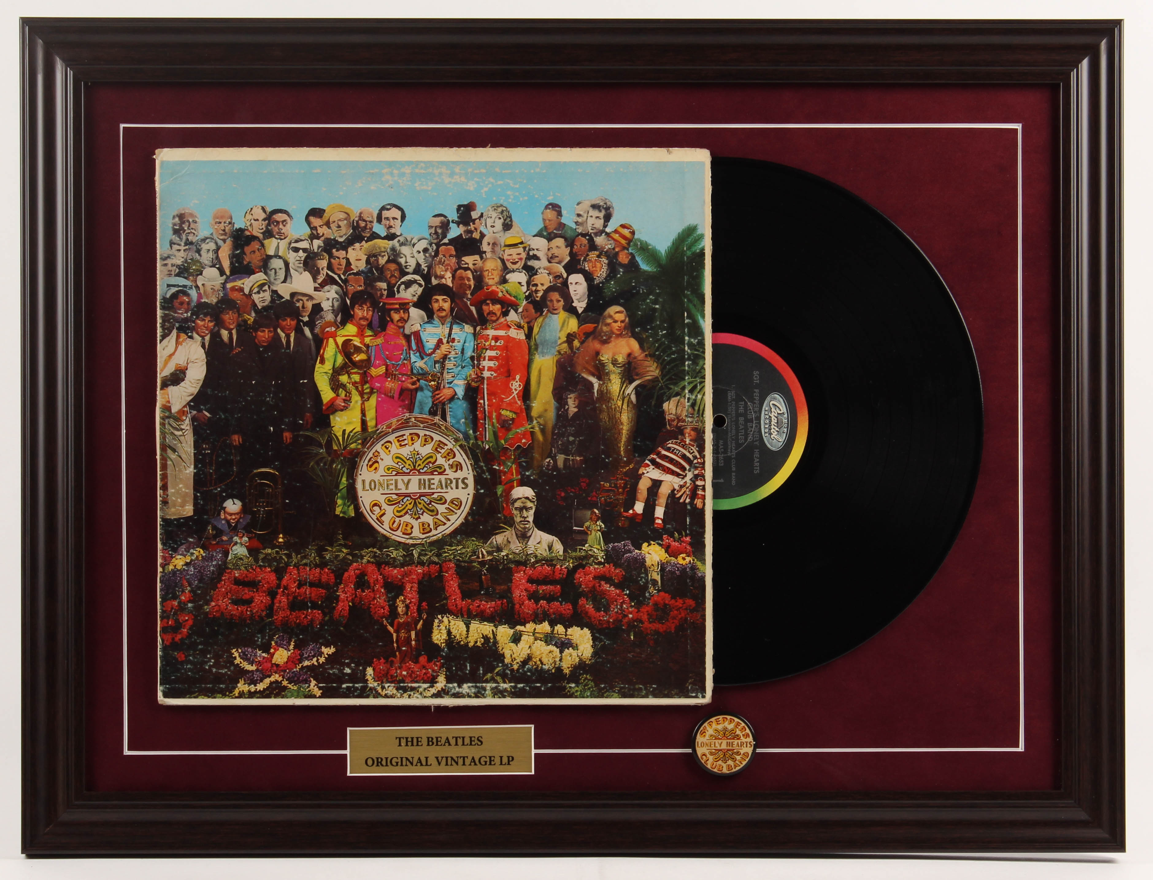 The Beatles "Lonely Hearts" 18.5x24.5 Custom Framed Vinyl Record Album Display with Vintage Sgt. Peppers Album Pin at PristineAuction.com The Beatles "Lonely Hearts" 18.5x24.5 Custom Framed Vinyl Record Album Display with Vintage Sgt. Peppers Album Pin at PristineAuction.com