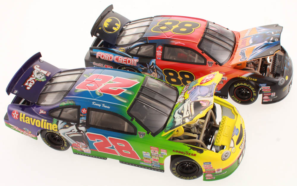 Lot of (2) 1:24 Scale Die Cast Cars with Dale Jarrett #88 Quality Care / Batman 1998 Ford Taurus & Kenny Irwin #28 Texaco / The Joker / Showdown at Charlotte 1998 Ford Taurus at PristineAuction.com Lot of (2) 1:24 Scale Die Cast Cars with Dale Jarrett #88 Quality Care / Batman 1998 Ford Taurus & Kenny Irwin #28 Texaco / The Joker / Showdown at Charlotte 1998 Ford Taurus at PristineAuction.com