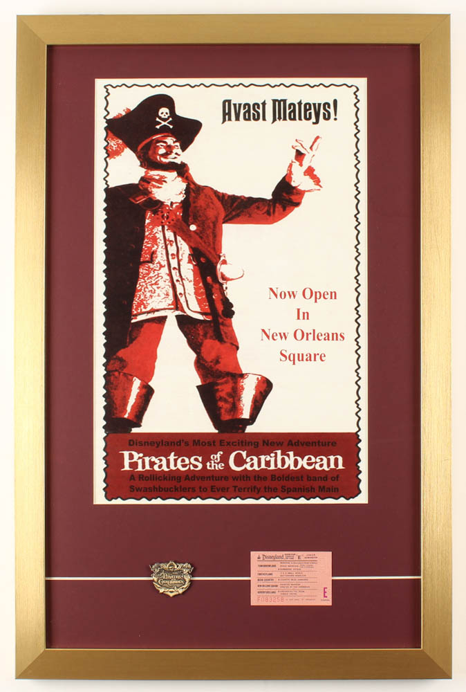 Walt Disney's "Pirates of the Caribbean" 17x26 Custom Framed Print Display with Ticket & Pirates of the Caribbean Pin at PristineAuction.com Walt Disney's "Pirates of the Caribbean" 17x26 Custom Framed Print Display with Ticket & Pirates of the Caribbean Pin at PristineAuction.com
