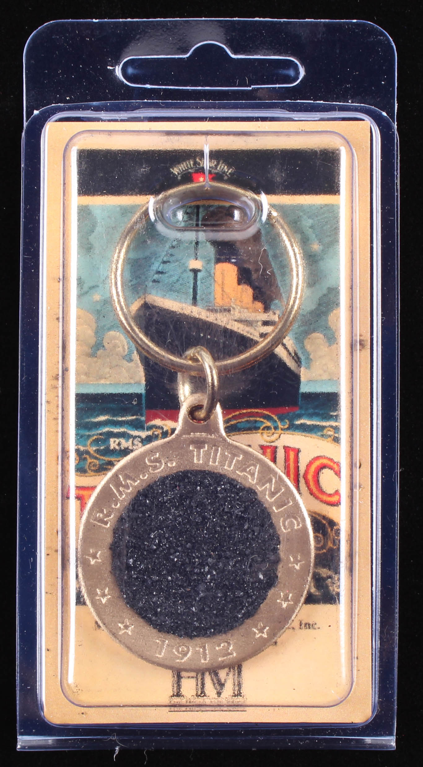 Authentic Coal From Titanic Wreckage in Bronze Keychain (RMS Titanic COA) at PristineAuction.com Authentic Coal From Titanic Wreckage in Bronze Keychain (RMS Titanic COA) at PristineAuction.com