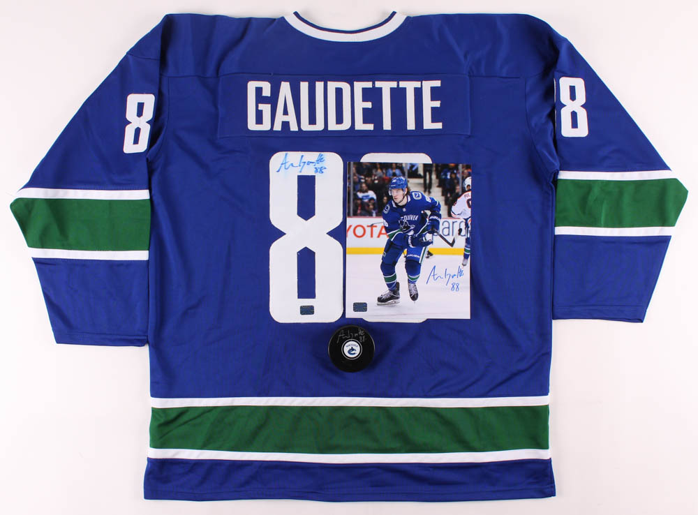 Lot of (3) Adam Gaudette Signed Canucks Logo Items with, Hockey Puck, Jersey & 8x10 Photo (Gaudette COA) at PristineAuction.com Lot of (3) Adam Gaudette Signed Canucks Logo Items with, Hockey Puck, Jersey & 8x10 Photo (Gaudette COA) at PristineAuction.com