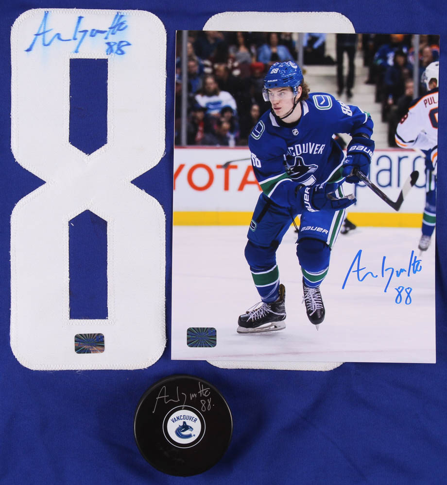 Lot of (3) Adam Gaudette Signed Canucks Logo Items with, Hockey Puck, Jersey & 8x10 Photo (Gaudette COA) at PristineAuction.com Lot of (3) Adam Gaudette Signed Canucks Logo Items with, Hockey Puck, Jersey & 8x10 Photo (Gaudette COA) at PristineAuction.com