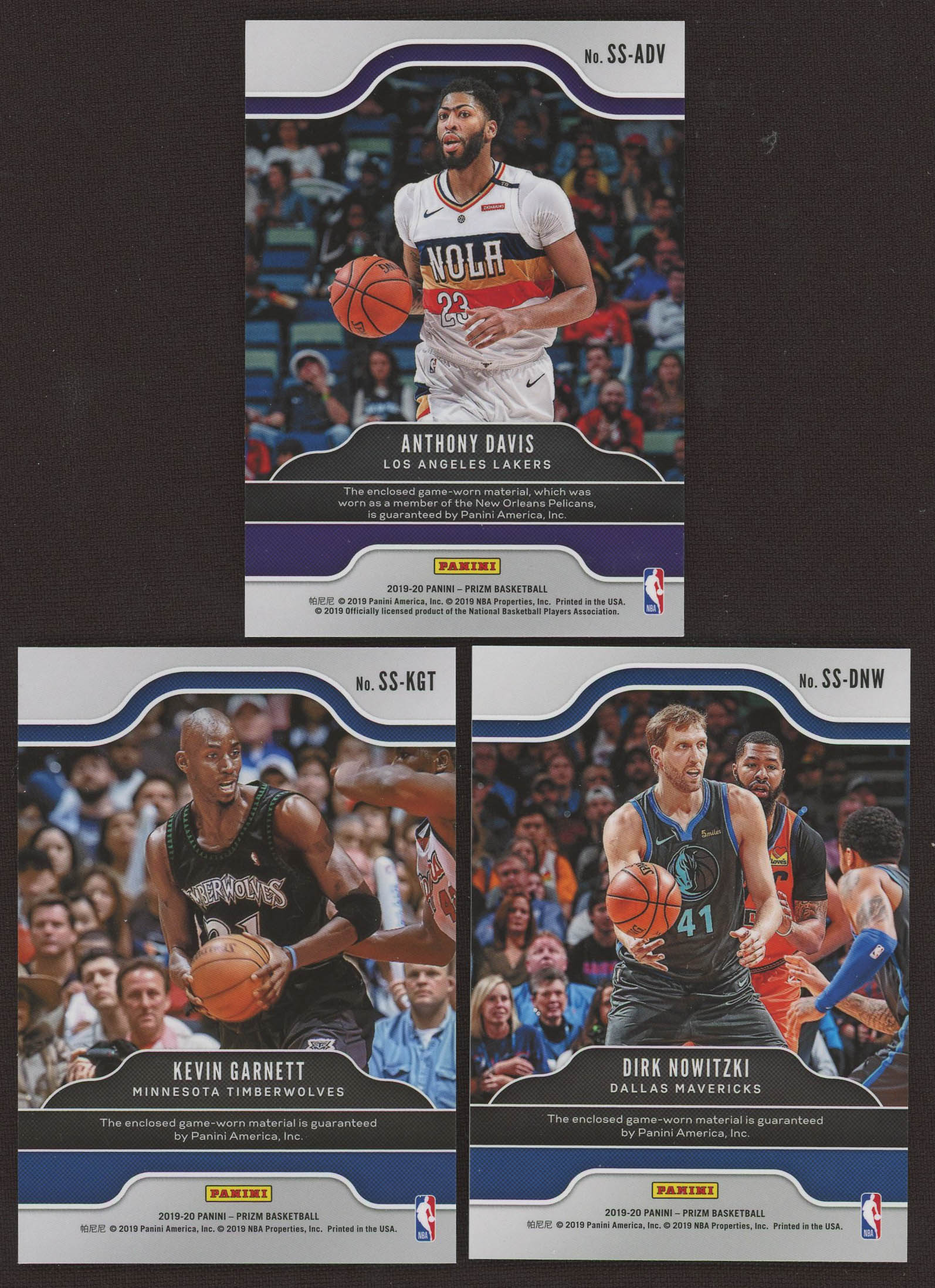 Lot of (3) 2019-20 Panini Prizm Sensational Swatches Basketball Cards with #76 Anthony Davis, #41 Dirk Nowitzki # #70 Kevin Garnett at PristineAuction.com Lot of (3) 2019-20 Panini Prizm Sensational Swatches Basketball Cards with #76 Anthony Davis, #41 Dirk Nowitzki # #70 Kevin Garnett at PristineAuction.com
