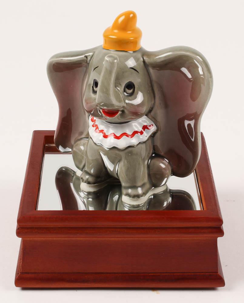 Vintage 1970's "Dumbo" Ceramic Figurine With Wood Base at PristineAuction.com Vintage 1970's "Dumbo" Ceramic Figurine With Wood Base at PristineAuction.com