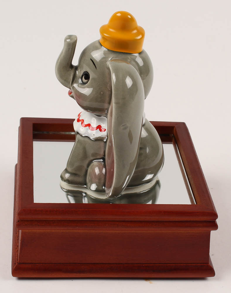 Vintage 1970's "Dumbo" Ceramic Figurine With Wood Base at PristineAuction.com Vintage 1970's "Dumbo" Ceramic Figurine With Wood Base at PristineAuction.com