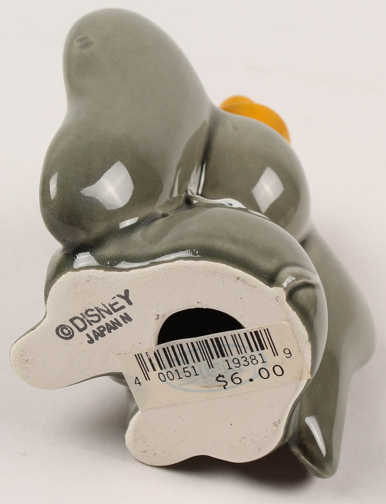 Vintage 1970's "Dumbo" Ceramic Figurine With Wood Base at PristineAuction.com Vintage 1970's "Dumbo" Ceramic Figurine With Wood Base at PristineAuction.com