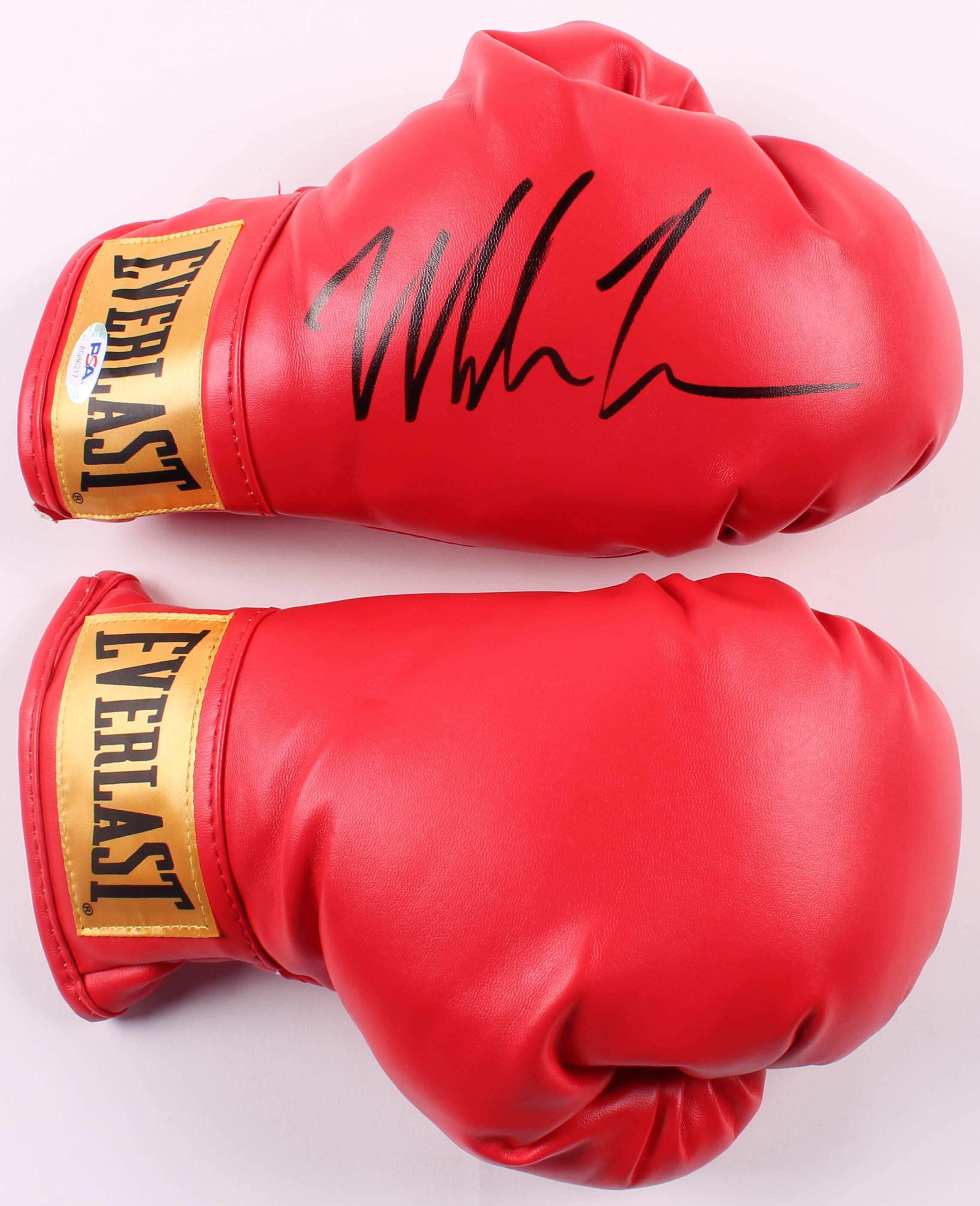 Mike Tyson Signed Everlast Boxing Gloves with Photo Display Case (PSA COA) at PristineAuction.com Mike Tyson Signed Everlast Boxing Gloves with Photo Display Case (PSA COA) at PristineAuction.com