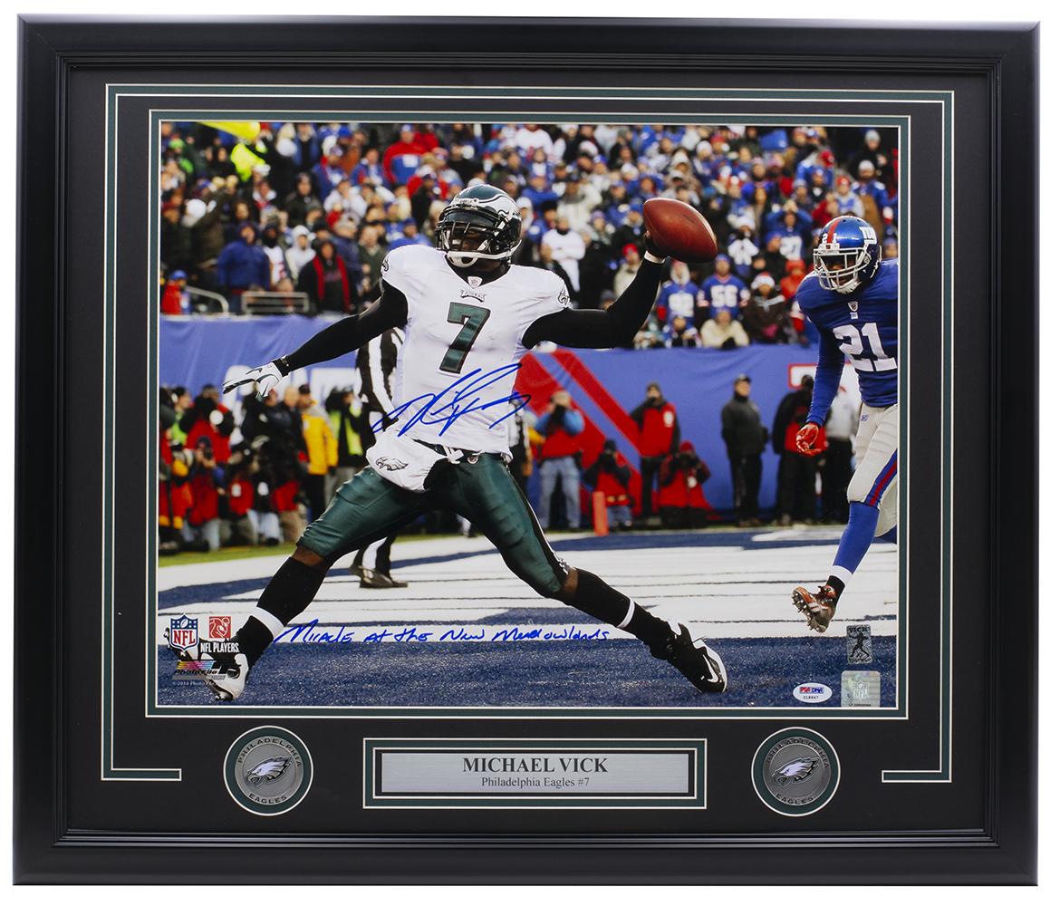 Michael Vick Signed Eagles 22x27 Custom Framed Photo Display with (2) Eagles Medallions Inscribed "Miracle At The New Meadowlands" (PSA COA & Vick Hologram) at PristineAuction.com Michael Vick Signed Eagles 22x27 Custom Framed Photo Display with (2) Eagles Medallions Inscribed "Miracle At The New Meadowlands" (PSA COA & Vick Hologram) at PristineAuction.com