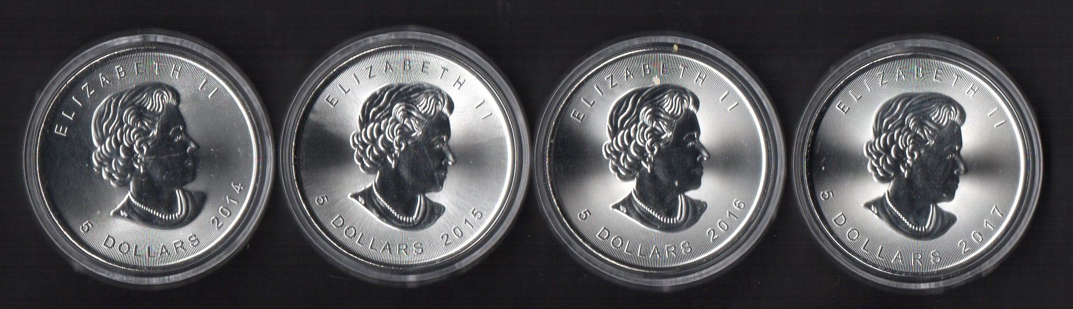 Lot of (4) Canadian Silver Maple Leaf $5 Dollar Coin with 2014, 2015, 2016 & 2017 at PristineAuction.com Lot of (4) Canadian Silver Maple Leaf $5 Dollar Coin with 2014, 2015, 2016 & 2017 at PristineAuction.com