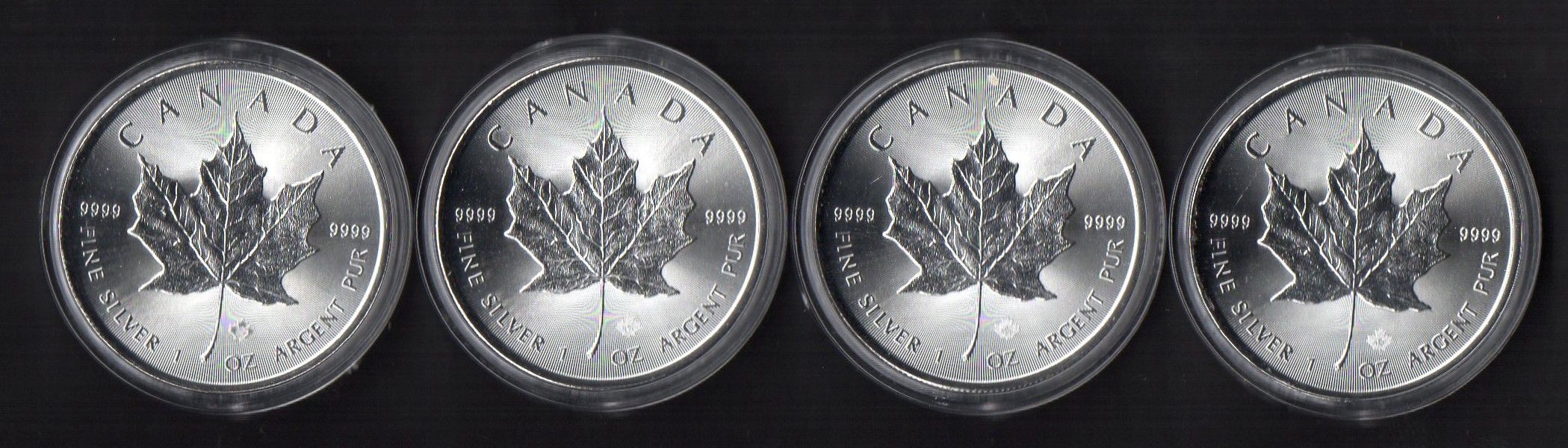 Lot of (4) Canadian Silver Maple Leaf $5 Dollar Coin with 2014, 2015, 2016 & 2017 at PristineAuction.com Lot of (4) Canadian Silver Maple Leaf $5 Dollar Coin with 2014, 2015, 2016 & 2017 at PristineAuction.com