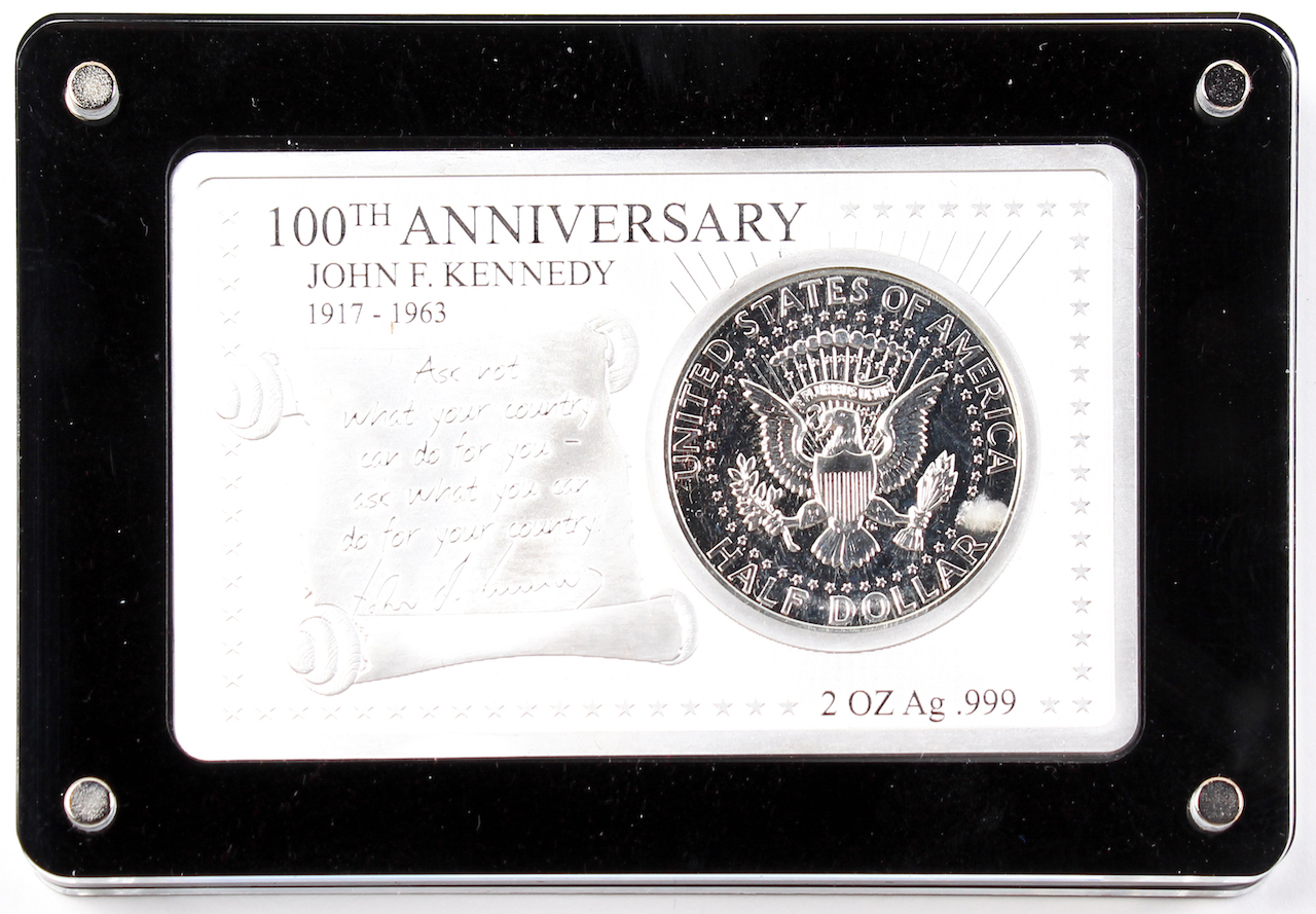 John F. Kennedy 100th Anniversary 2 oz. .999 Silver Bar with 1964 Kennedy Half Dollar at PristineAuction.com John F. Kennedy 100th Anniversary 2 oz. .999 Silver Bar with 1964 Kennedy Half Dollar at PristineAuction.com