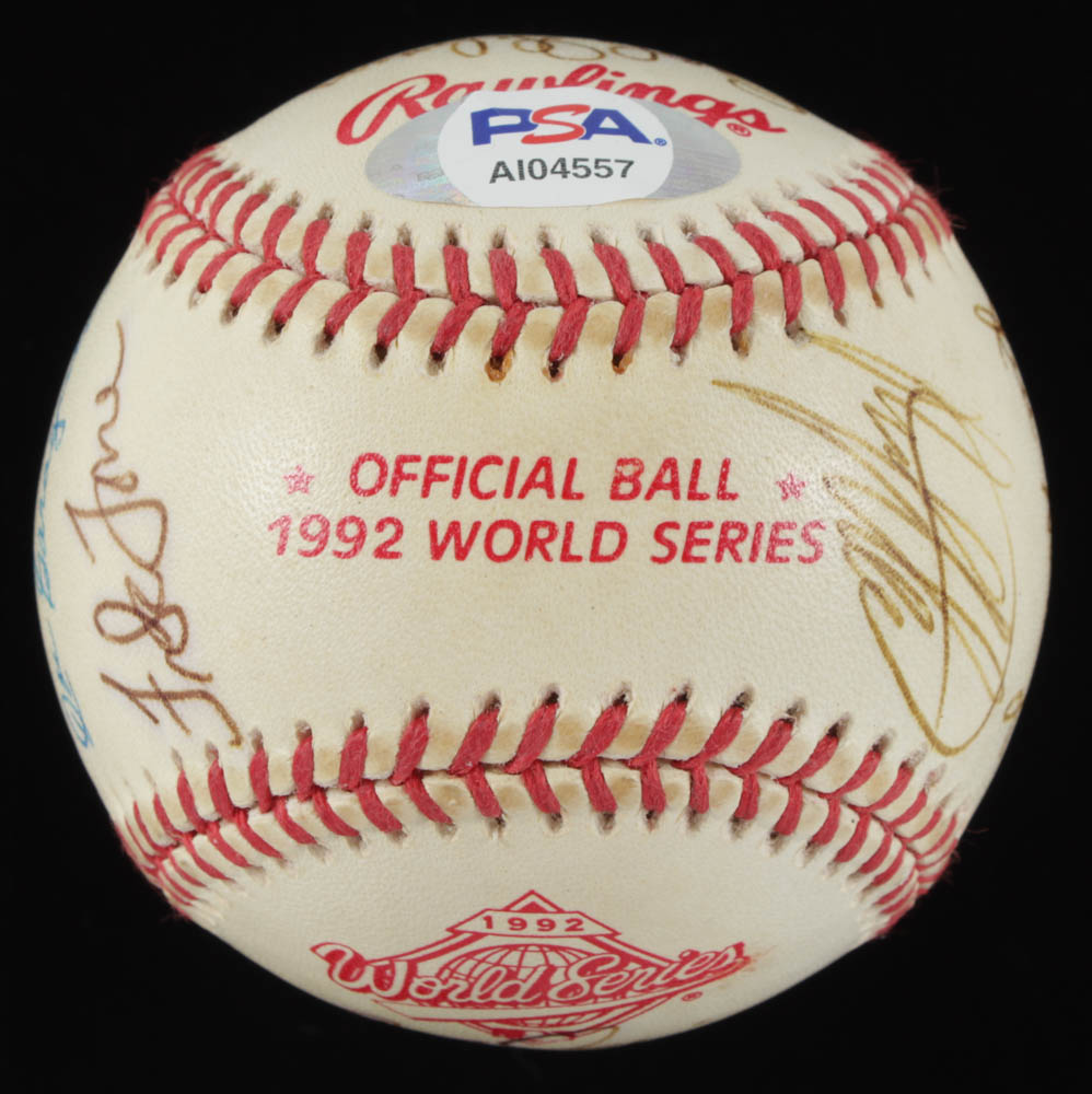 1992 World Series Baseball Team-Signed by (13) With Ted Williams, Larry Doby, Warren Spahn, Bob Gibson, Joe Garagiola With Display Case (PSA LOA) at PristineAuction.com 1992 World Series Baseball Team-Signed by (13) With Ted Williams, Larry Doby, Warren Spahn, Bob Gibson, Joe Garagiola With Display Case (PSA LOA) at PristineAuction.com