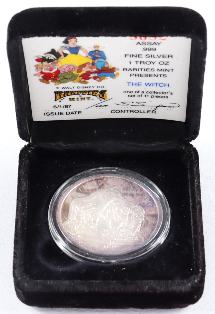 1987 LE Walt Disney's 50th Anniversary Snow White's "The Witch" 1 Troy Ounce Fine Silver Coin at PristineAuction.com 1987 LE Walt Disney's 50th Anniversary Snow White's "The Witch" 1 Troy Ounce Fine Silver Coin at PristineAuction.com