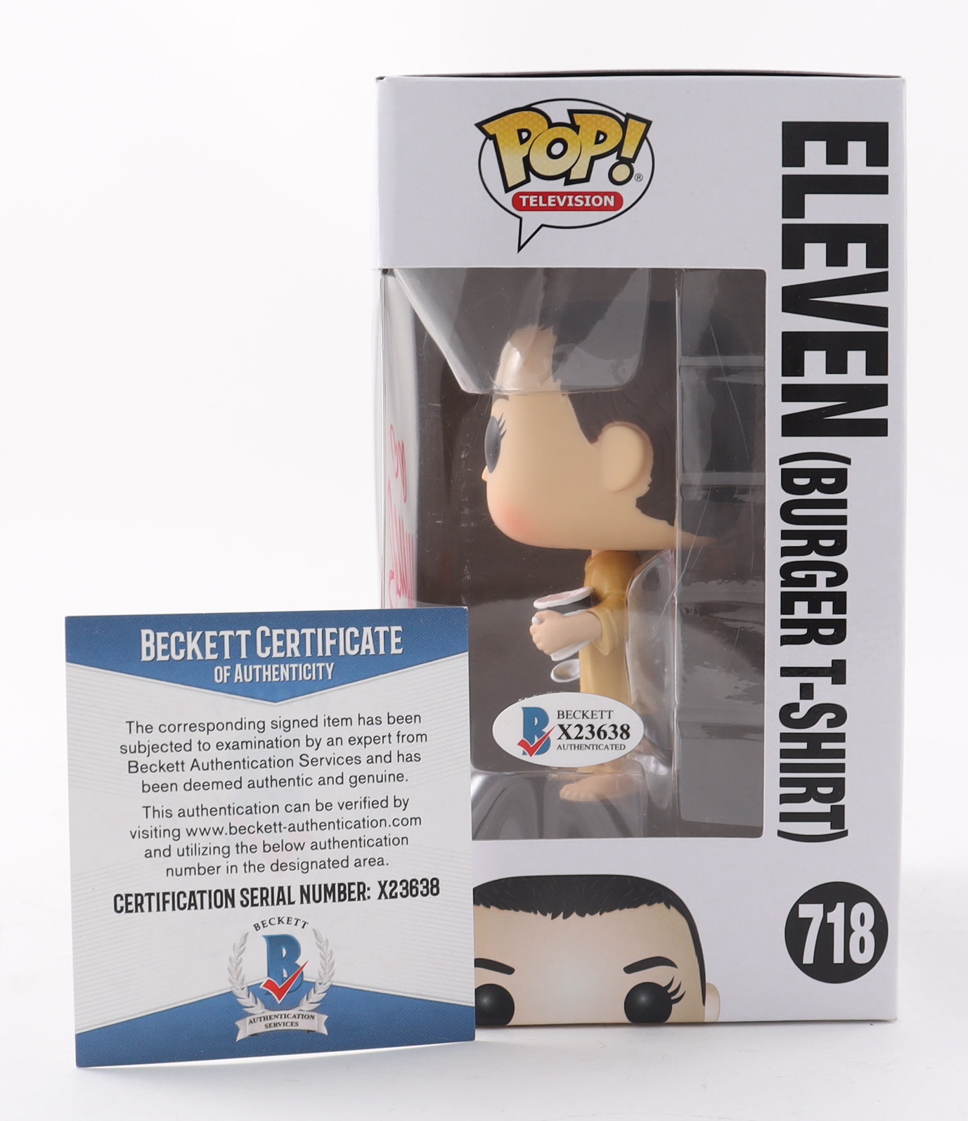 Millie Bobby Brown Signed "Stranger Things" #718 Eleven (Burger T-Shirt) Funko Pop! Vinyl Figure Inscribed "011" (Beckett COA) (See Description) at PristineAuction.com Millie Bobby Brown Signed "Stranger Things" #718 Eleven (Burger T-Shirt) Funko Pop! Vinyl Figure Inscribed "011" (Beckett COA) (See Description) at PristineAuction.com