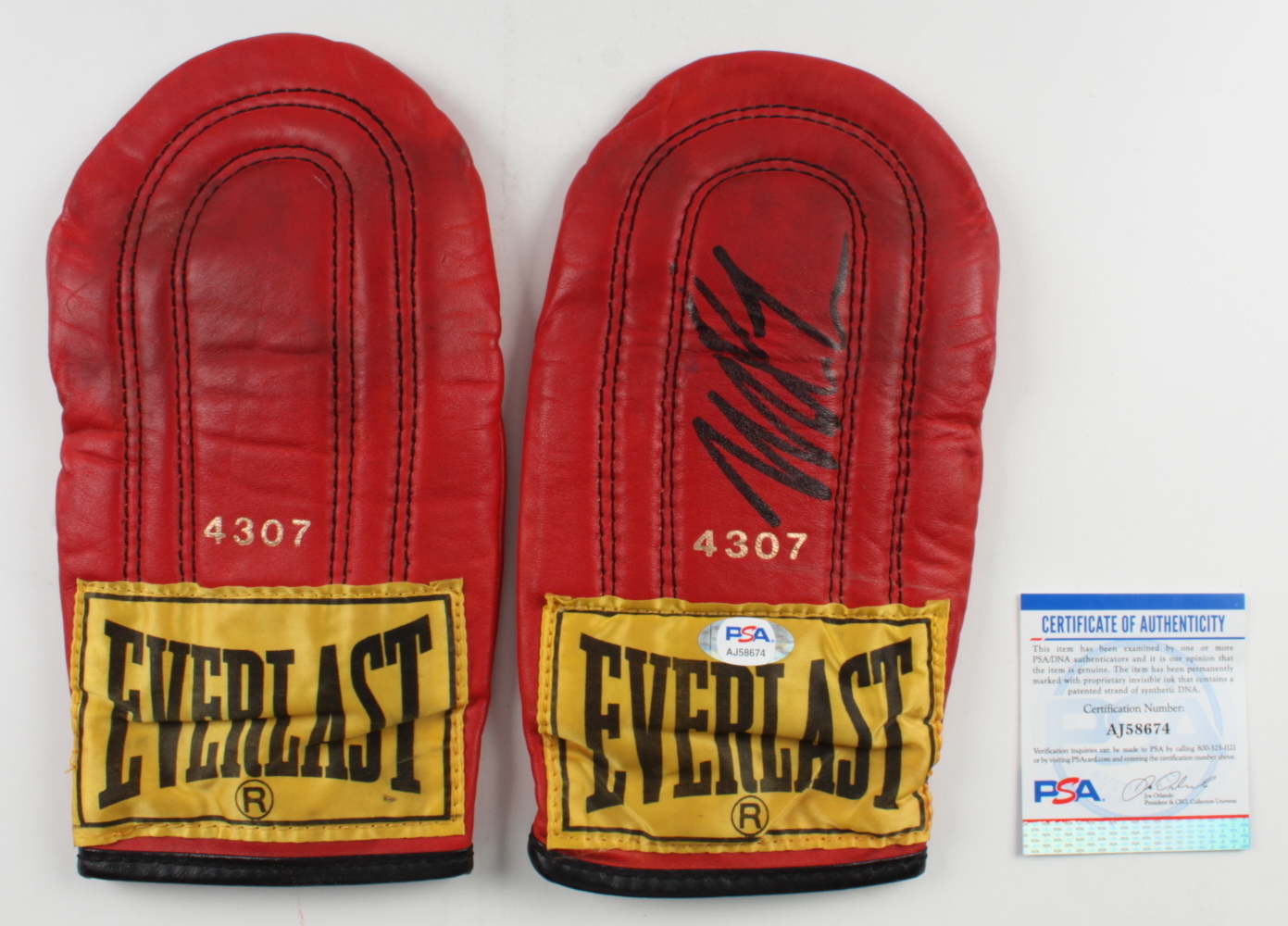 Mike Tyson Signed Pair of Everlast Boxing Gloves with Hand Wrap & Display Case (PSA COA) at PristineAuction.com Mike Tyson Signed Pair of Everlast Boxing Gloves with Hand Wrap & Display Case (PSA COA) at PristineAuction.com
