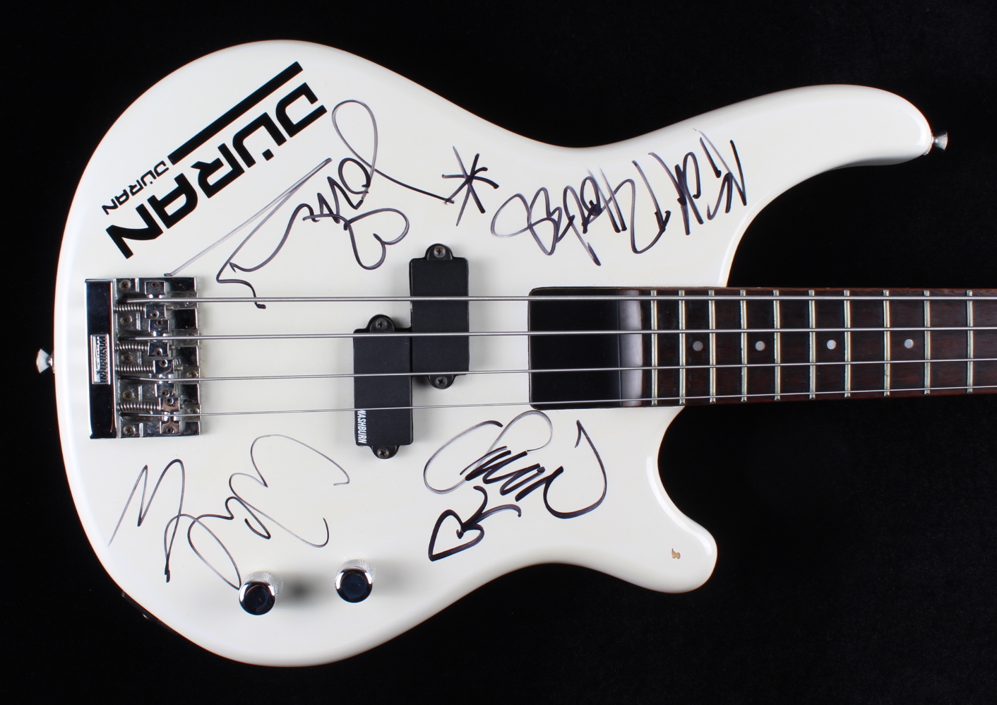 "Duran Duran" 46" Full-Size Electric Bass Guitar Signed by (4) with Simon Le Bon, Nick Rhodes, John Taylor & Warren Cuccurullo (JSA Hologram) at PristineAuction.com "Duran Duran" 46" Full-Size Electric Bass Guitar Signed by (4) with Simon Le Bon, Nick Rhodes, John Taylor & Warren Cuccurullo (JSA Hologram) at PristineAuction.com