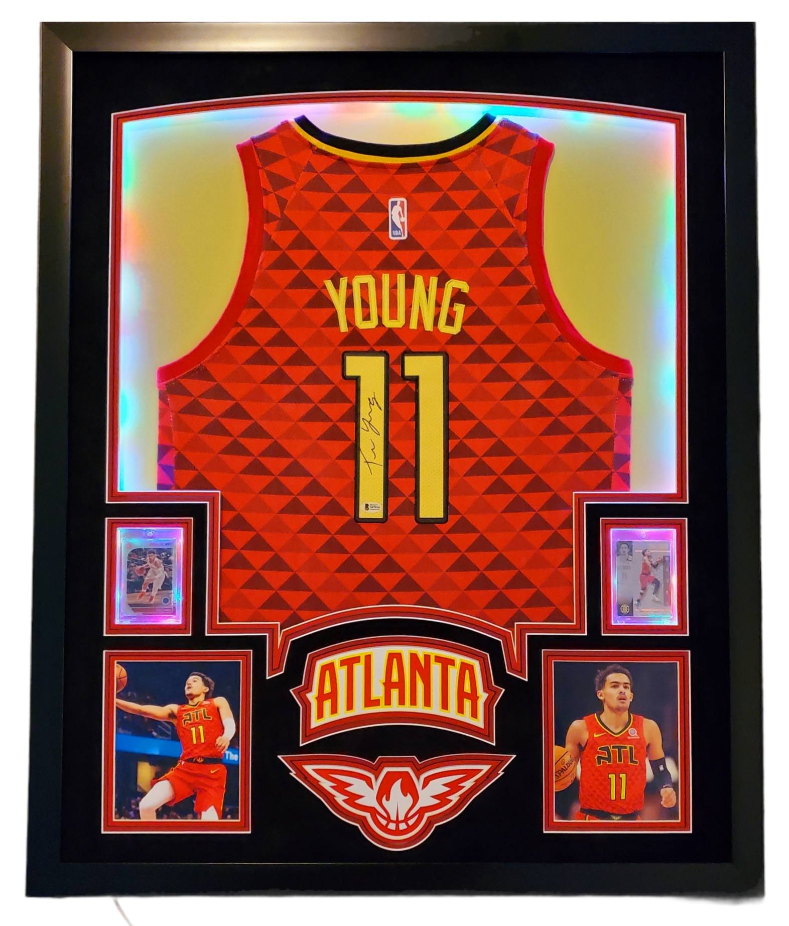 Trae Young Signed 35x43 Custom Framed Jersey Display with 2019-20 Hoops Premium Stock #1 & 2019-20 Panini Illusions #136 (Beckett LOA) at PristineAuction.com Trae Young Signed 35x43 Custom Framed Jersey Display with 2019-20 Hoops Premium Stock #1 & 2019-20 Panini Illusions #136 (Beckett LOA) at PristineAuction.com