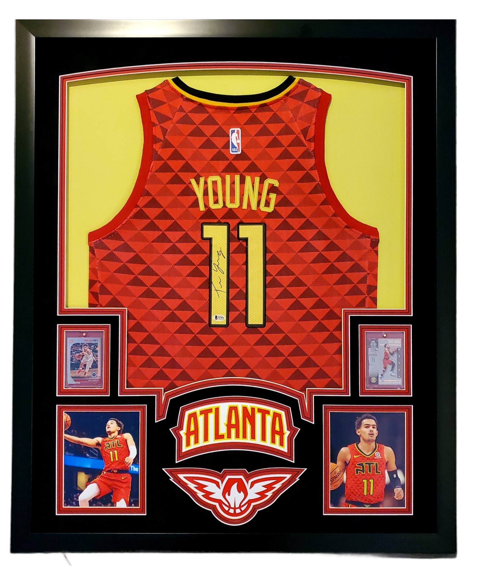 Trae Young Signed 35x43 Custom Framed Jersey Display with 2019-20 Hoops Premium Stock #1 & 2019-20 Panini Illusions #136 (Beckett LOA) at PristineAuction.com Trae Young Signed 35x43 Custom Framed Jersey Display with 2019-20 Hoops Premium Stock #1 & 2019-20 Panini Illusions #136 (Beckett LOA) at PristineAuction.com