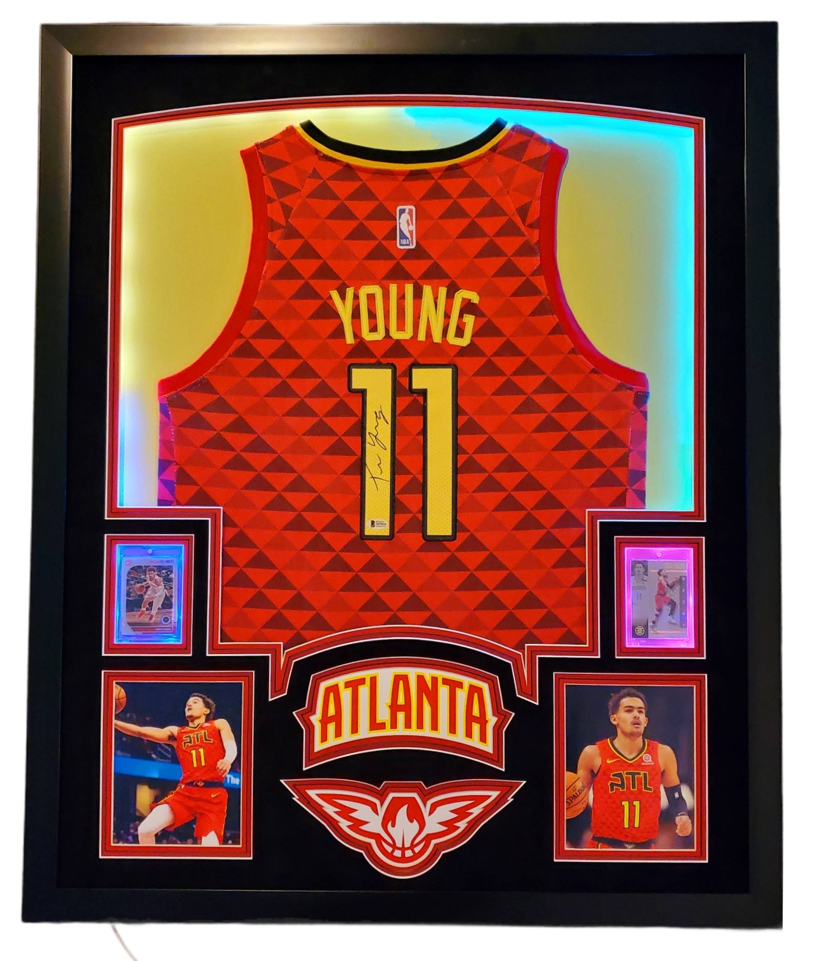 Trae Young Signed 35x43 Custom Framed Jersey Display with 2019-20 Hoops Premium Stock #1 & 2019-20 Panini Illusions #136 (Beckett LOA) at PristineAuction.com Trae Young Signed 35x43 Custom Framed Jersey Display with 2019-20 Hoops Premium Stock #1 & 2019-20 Panini Illusions #136 (Beckett LOA) at PristineAuction.com