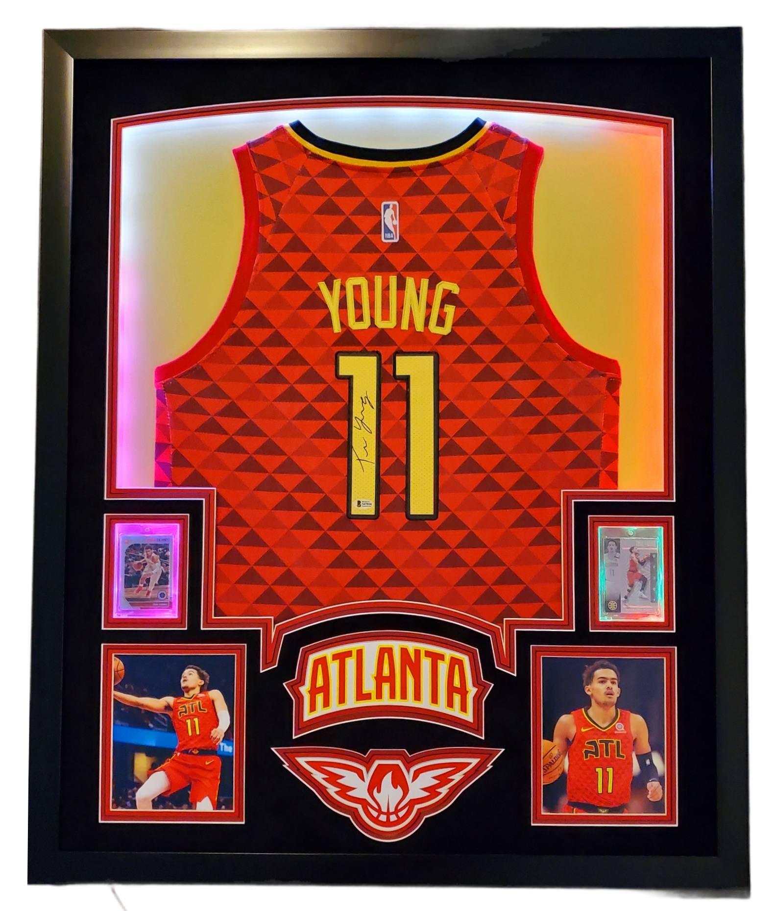 Trae Young Signed 35x43 Custom Framed Jersey Display with 2019-20 Hoops Premium Stock #1 & 2019-20 Panini Illusions #136 (Beckett LOA) at PristineAuction.com Trae Young Signed 35x43 Custom Framed Jersey Display with 2019-20 Hoops Premium Stock #1 & 2019-20 Panini Illusions #136 (Beckett LOA) at PristineAuction.com