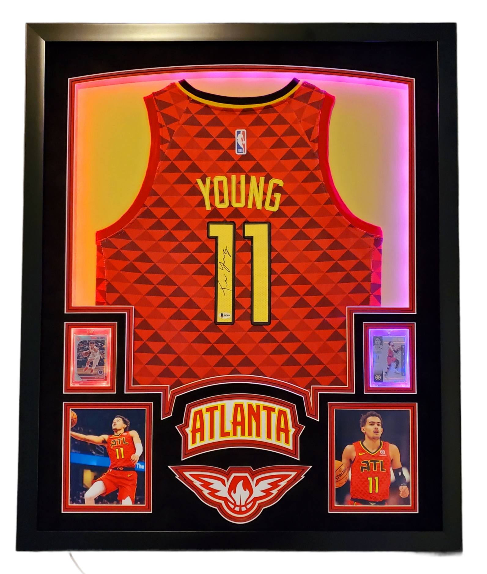 Trae Young Signed 35x43 Custom Framed Jersey Display with 2019-20 Hoops Premium Stock #1 & 2019-20 Panini Illusions #136 (Beckett LOA) at PristineAuction.com Trae Young Signed 35x43 Custom Framed Jersey Display with 2019-20 Hoops Premium Stock #1 & 2019-20 Panini Illusions #136 (Beckett LOA) at PristineAuction.com