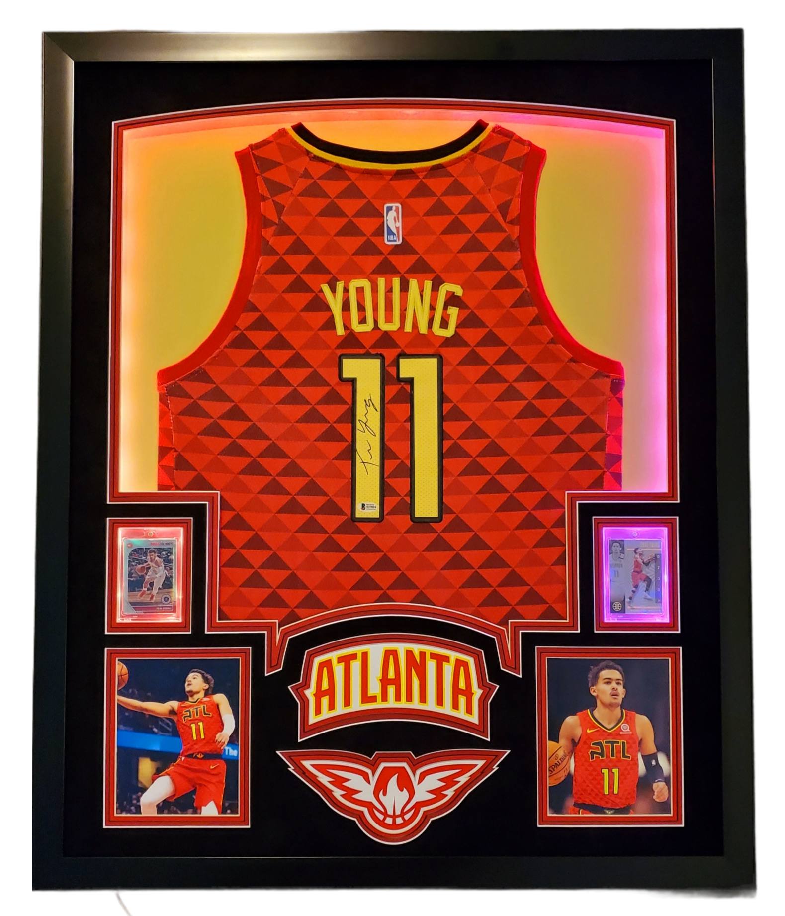 Trae Young Signed 35x43 Custom Framed Jersey Display with 2019-20 Hoops Premium Stock #1 & 2019-20 Panini Illusions #136 (Beckett LOA) at PristineAuction.com Trae Young Signed 35x43 Custom Framed Jersey Display with 2019-20 Hoops Premium Stock #1 & 2019-20 Panini Illusions #136 (Beckett LOA) at PristineAuction.com
