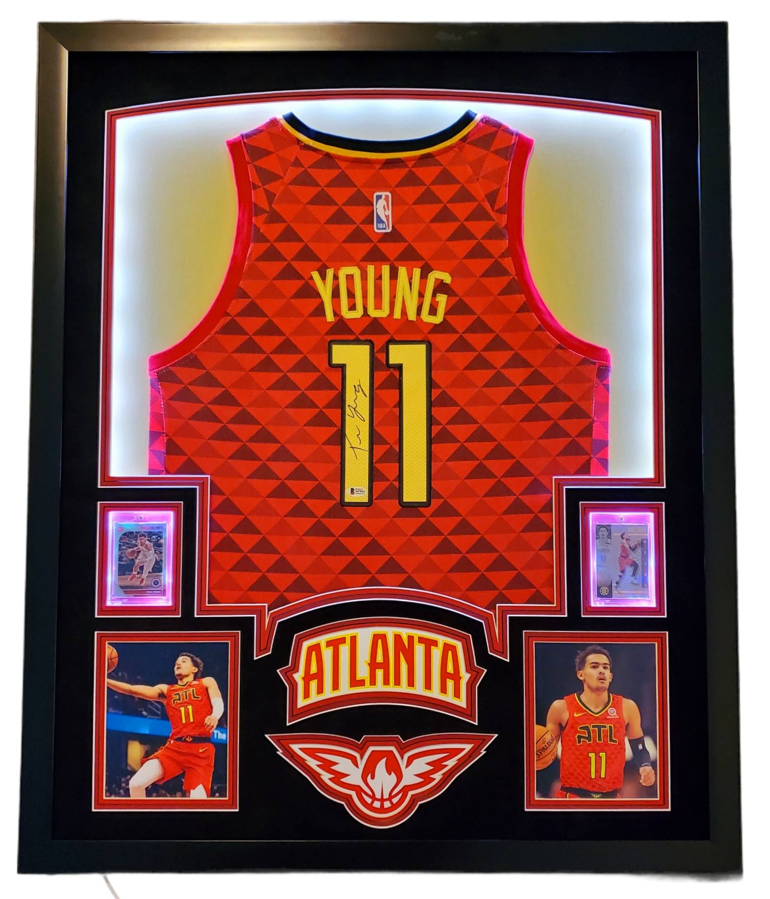 Trae Young Signed 35x43 Custom Framed Jersey Display with 2019-20 Hoops Premium Stock #1 & 2019-20 Panini Illusions #136 (Beckett LOA) at PristineAuction.com Trae Young Signed 35x43 Custom Framed Jersey Display with 2019-20 Hoops Premium Stock #1 & 2019-20 Panini Illusions #136 (Beckett LOA) at PristineAuction.com
