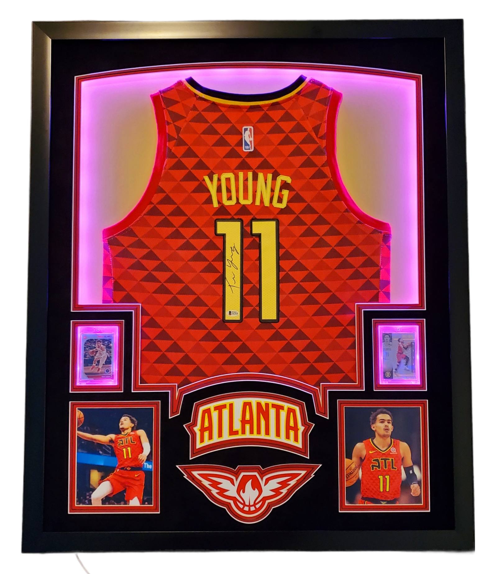 Trae Young Signed 35x43 Custom Framed Jersey Display with 2019-20 Hoops Premium Stock #1 & 2019-20 Panini Illusions #136 (Beckett LOA) at PristineAuction.com Trae Young Signed 35x43 Custom Framed Jersey Display with 2019-20 Hoops Premium Stock #1 & 2019-20 Panini Illusions #136 (Beckett LOA) at PristineAuction.com