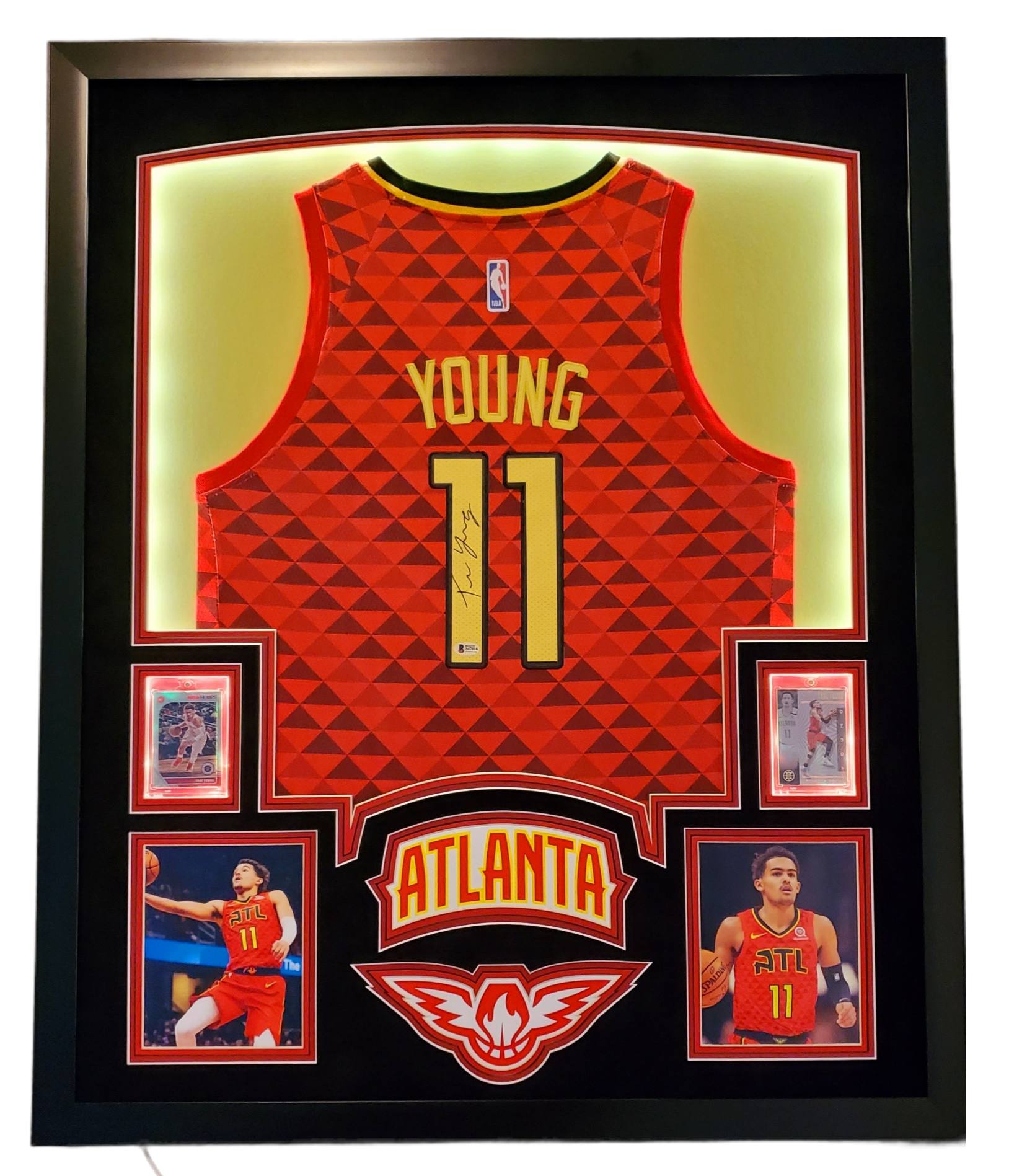 Trae Young Signed 35x43 Custom Framed Jersey Display with 2019-20 Hoops Premium Stock #1 & 2019-20 Panini Illusions #136 (Beckett LOA) at PristineAuction.com Trae Young Signed 35x43 Custom Framed Jersey Display with 2019-20 Hoops Premium Stock #1 & 2019-20 Panini Illusions #136 (Beckett LOA) at PristineAuction.com