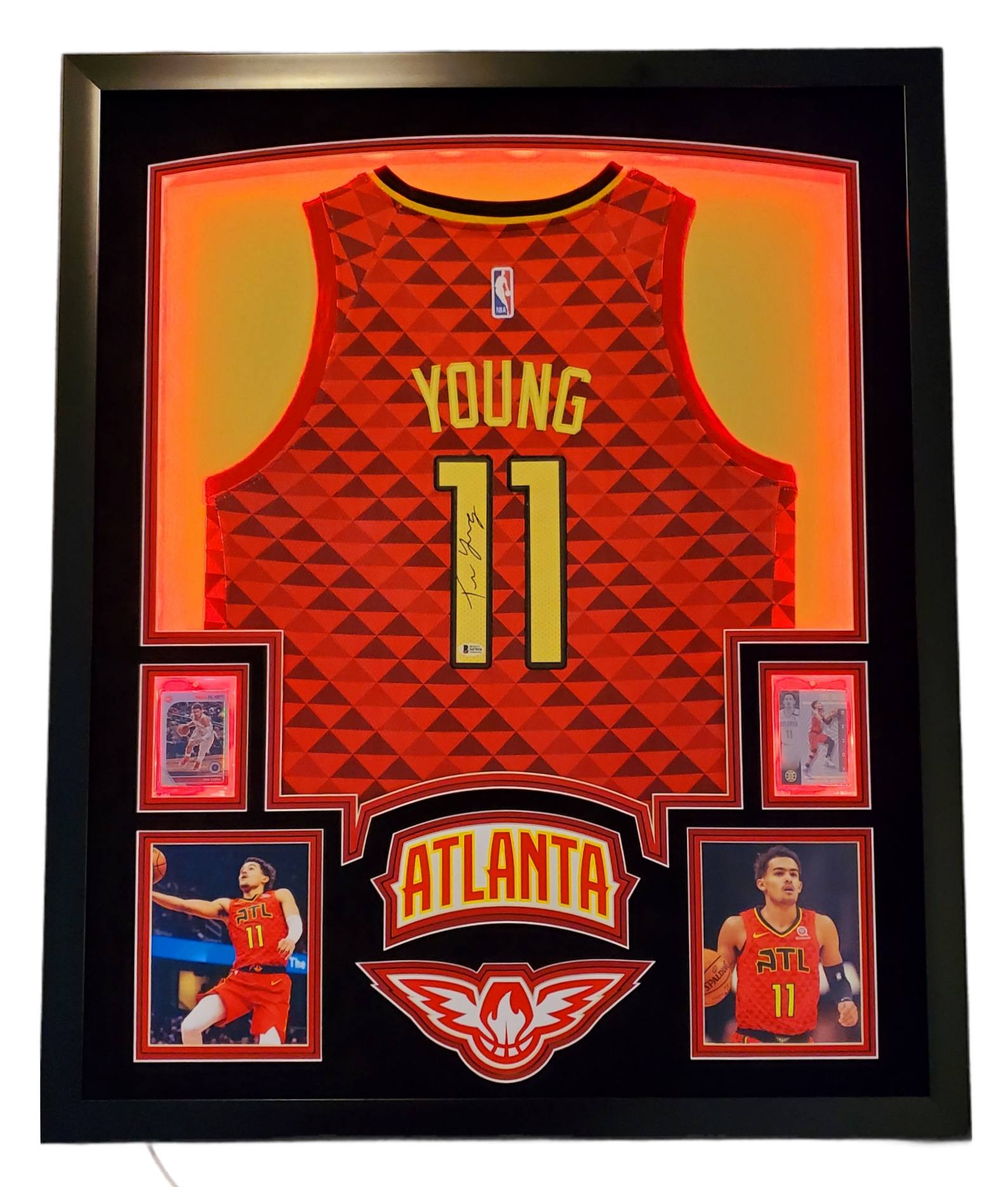 Trae Young Signed 35x43 Custom Framed Jersey Display with 2019-20 Hoops Premium Stock #1 & 2019-20 Panini Illusions #136 (Beckett LOA) at PristineAuction.com Trae Young Signed 35x43 Custom Framed Jersey Display with 2019-20 Hoops Premium Stock #1 & 2019-20 Panini Illusions #136 (Beckett LOA) at PristineAuction.com
