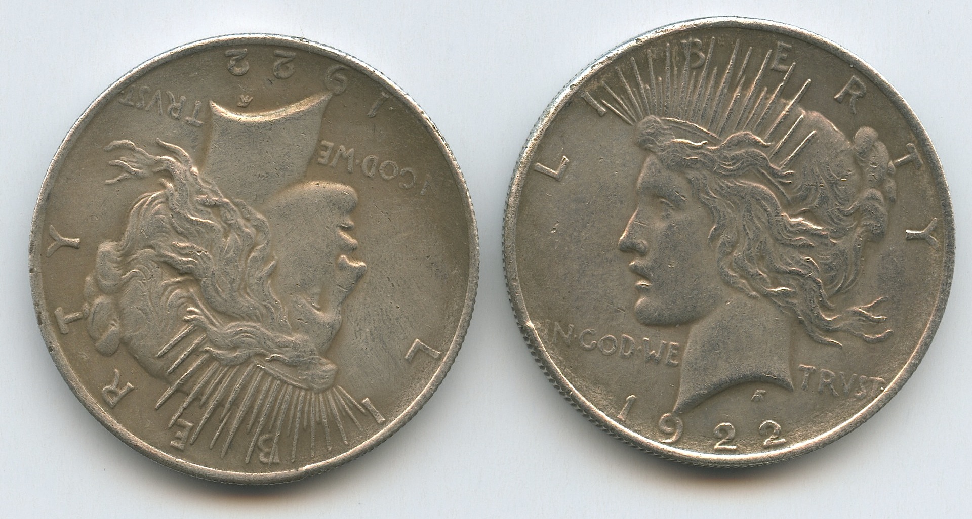 Harvey Dent "Batman: The Dark Knight" Two Face Double-Sided 1922 Peace Dollar Movie Prop Coin Replica at PristineAuction.com Harvey Dent "Batman: The Dark Knight" Two Face Double-Sided 1922 Peace Dollar Movie Prop Coin Replica at PristineAuction.com