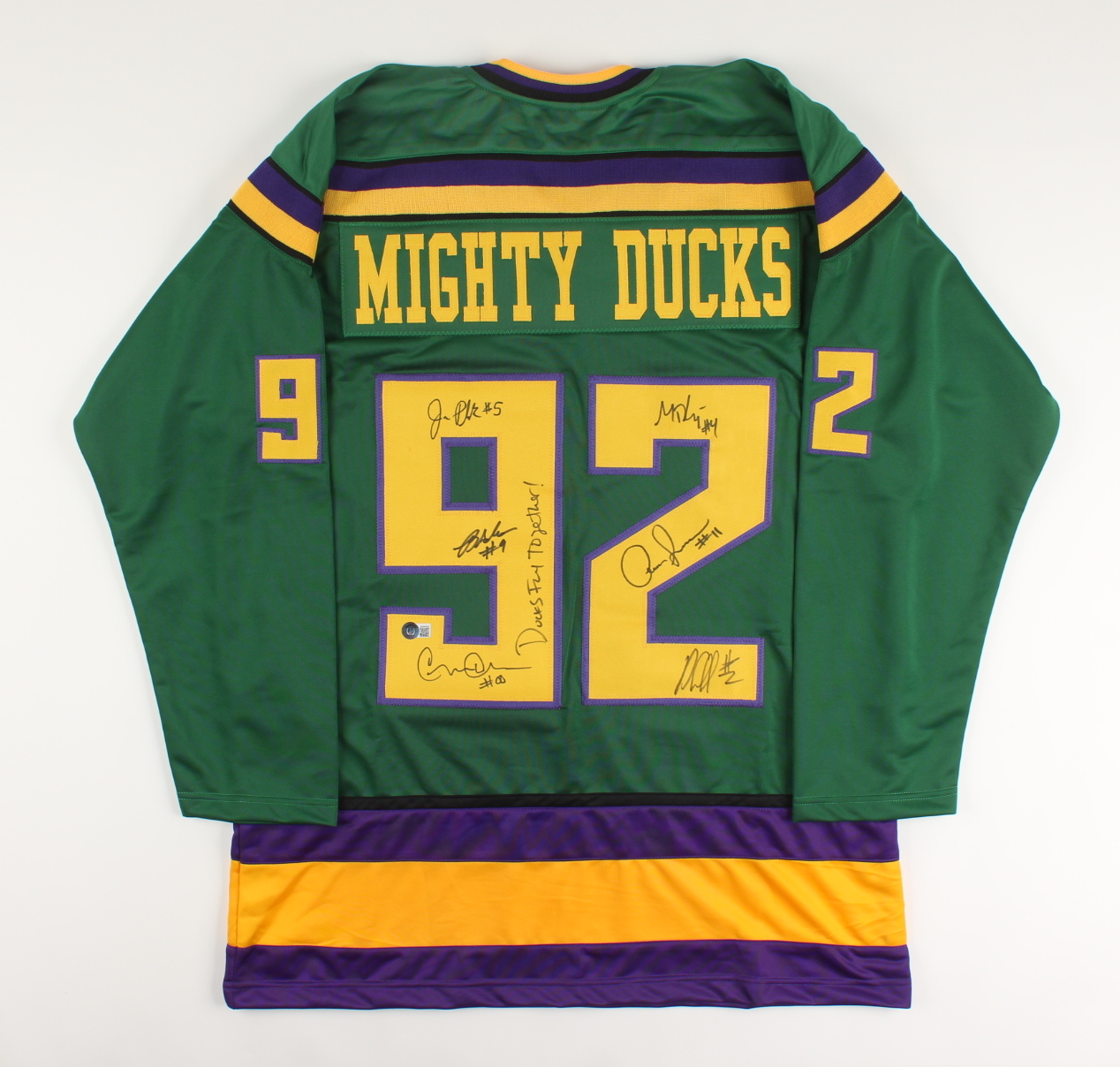 "The Mighty Ducks" Jersey Cast-Signed by (6) with Brandon Adams, Jane Plank, Matt Doherty, Garette Henson Inscribed "Ducks Fly Together!" (Beckett) at PristineAuction.com "The Mighty Ducks" Jersey Cast-Signed by (6) with Brandon Adams, Jane Plank, Matt Doherty, Garette Henson Inscribed "Ducks Fly Together!" (Beckett) at PristineAuction.com
