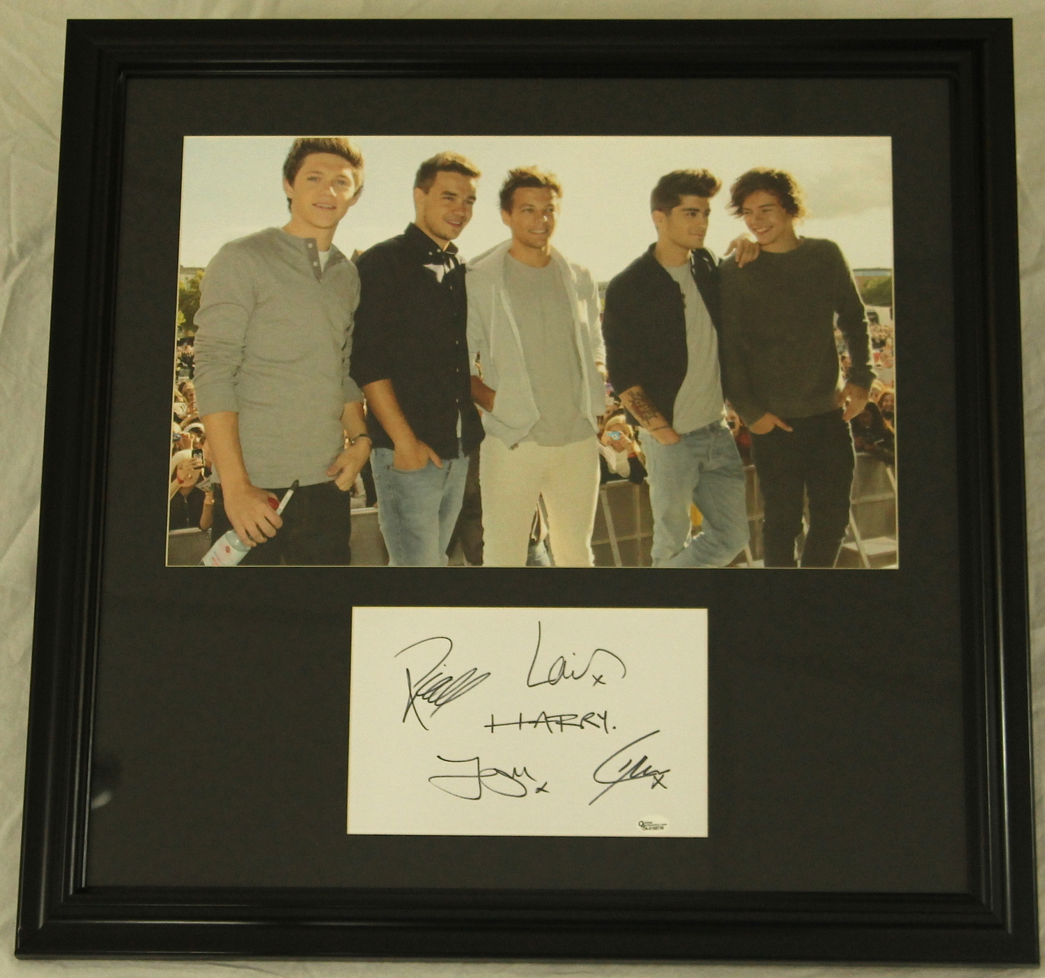 Louis Tomlinson, Harry Styles, Liam Payne, Zayn Malik & Niall Horan Signed "One Direction" 23x23 Custom Framed Display (Online Authentics COA) at PristineAuction.com Louis Tomlinson, Harry Styles, Liam Payne, Zayn Malik & Niall Horan Signed "One Direction" 23x23 Custom Framed Display (Online Authentics COA) at PristineAuction.com