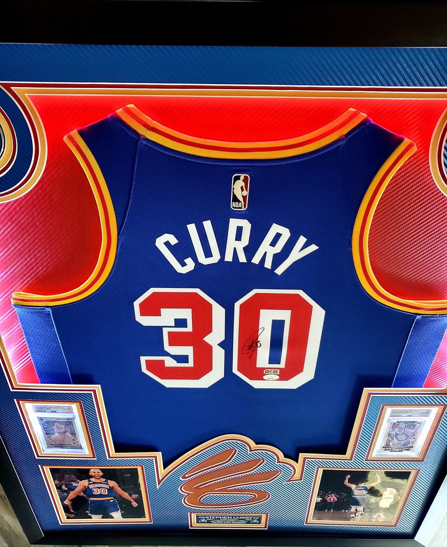 Steph Curry Signed 33x42 Custom Framed LED-Backlit Jersey Display with 2016-17 Select #88 (PSA 10) & 2019-20 Hoops Premium Stock Prizms Pulsar #59 (PSA 10) (JSA & Curry) at PristineAuction.com Steph Curry Signed 33x42 Custom Framed LED-Backlit Jersey Display with 2016-17 Select #88 (PSA 10) & 2019-20 Hoops Premium Stock Prizms Pulsar #59 (PSA 10) (JSA & Curry) at PristineAuction.com