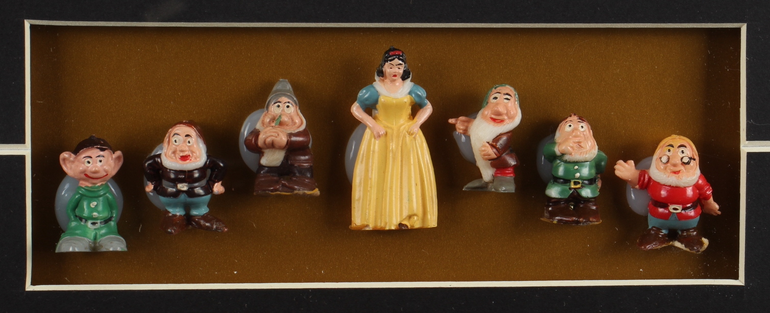 Walt Disney's "Snow White & The Seven Dwarfs" 15x24 Custom Framed Print Display with (7) Original 1960 Disney Ceramic Figures at PristineAuction.com Walt Disney's "Snow White & The Seven Dwarfs" 15x24 Custom Framed Print Display with (7) Original 1960 Disney Ceramic Figures at PristineAuction.com