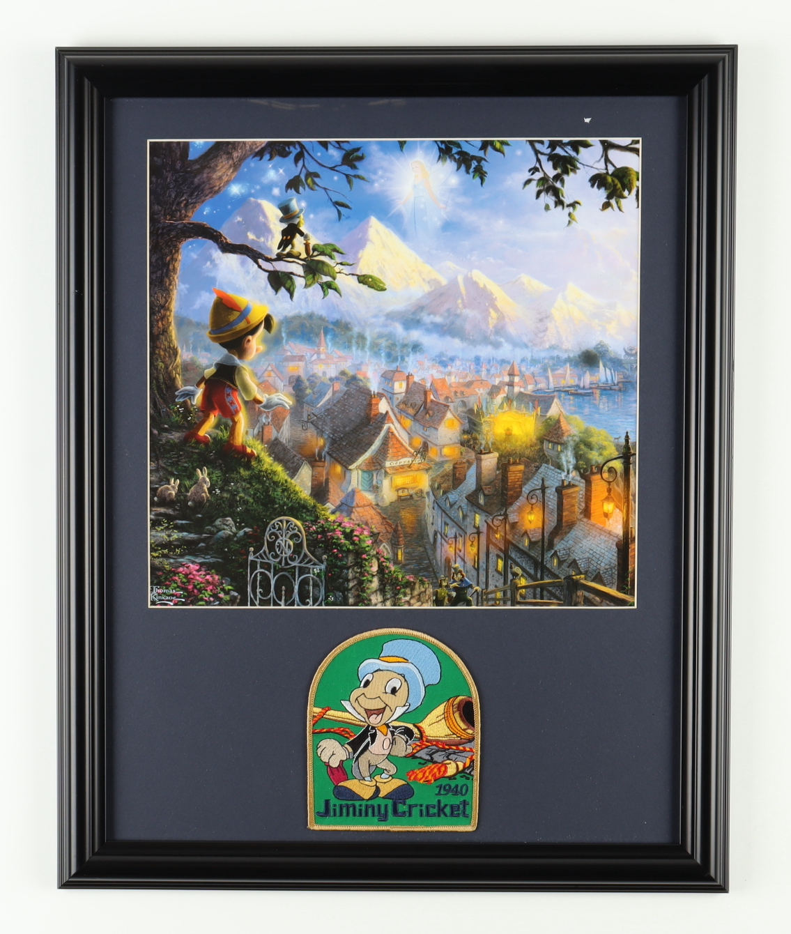 Thomas Kinkade Walt Disney's "Pinocchio" 16x20 Custom Framed Print Display with Pinocchio Patch at PristineAuction.com Thomas Kinkade Walt Disney's "Pinocchio" 16x20 Custom Framed Print Display with Pinocchio Patch at PristineAuction.com