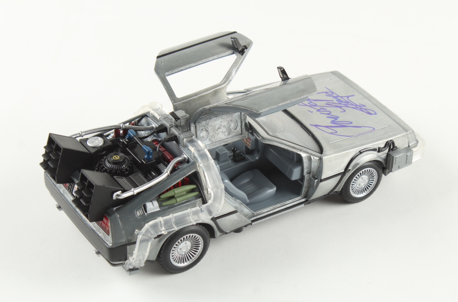 Christopher Lloyd Signed "Back to the Future" DeLorean Time Machine 1:24 Scale Die-Cast Car (Schwartz) at PristineAuction.com Christopher Lloyd Signed "Back to the Future" DeLorean Time Machine 1:24 Scale Die-Cast Car (Schwartz) at PristineAuction.com