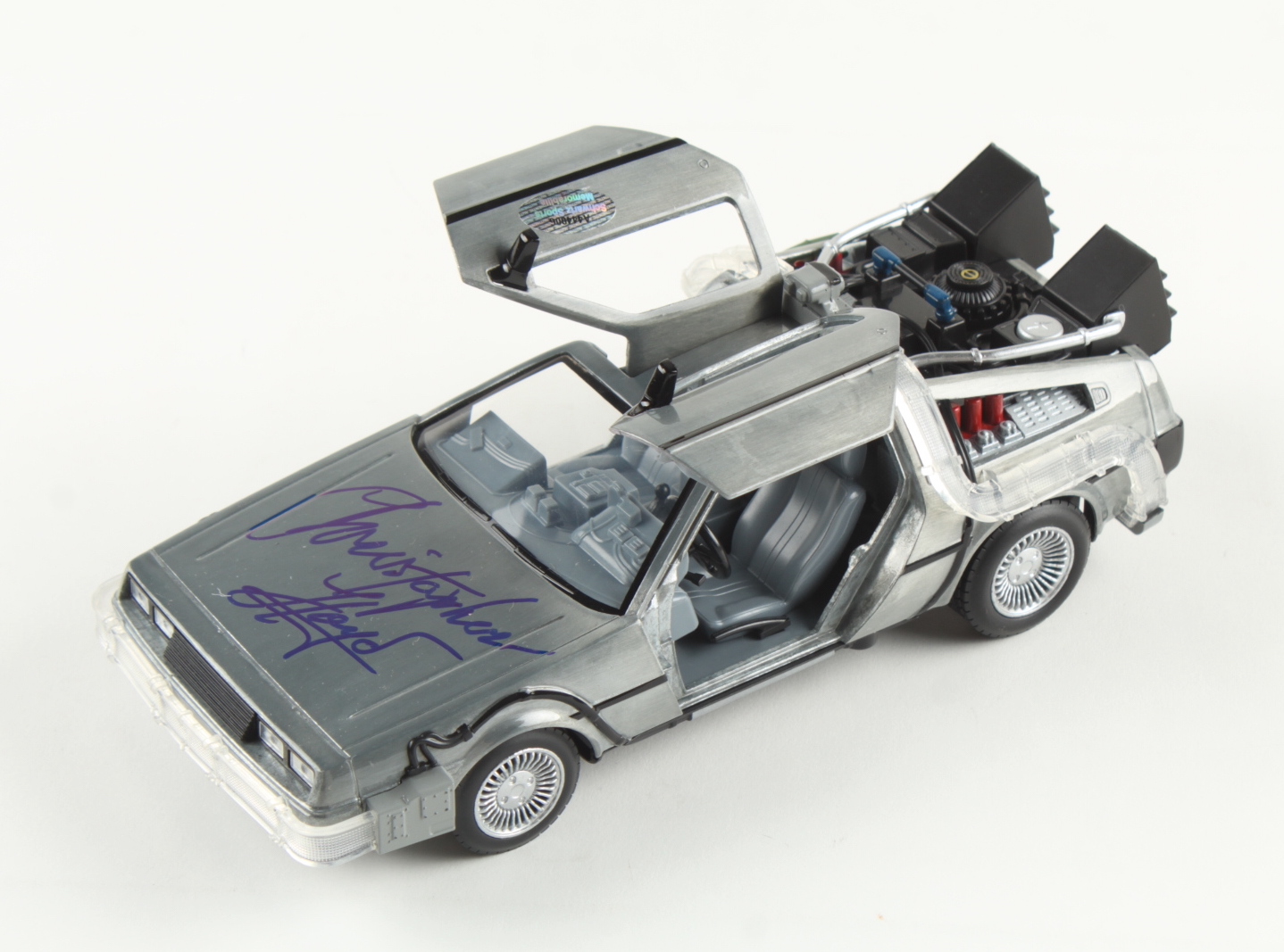 Christopher Lloyd Signed "Back to the Future" DeLorean Time Machine 1:24 Scale Die-Cast Car (Schwartz) at PristineAuction.com Christopher Lloyd Signed "Back to the Future" DeLorean Time Machine 1:24 Scale Die-Cast Car (Schwartz) at PristineAuction.com