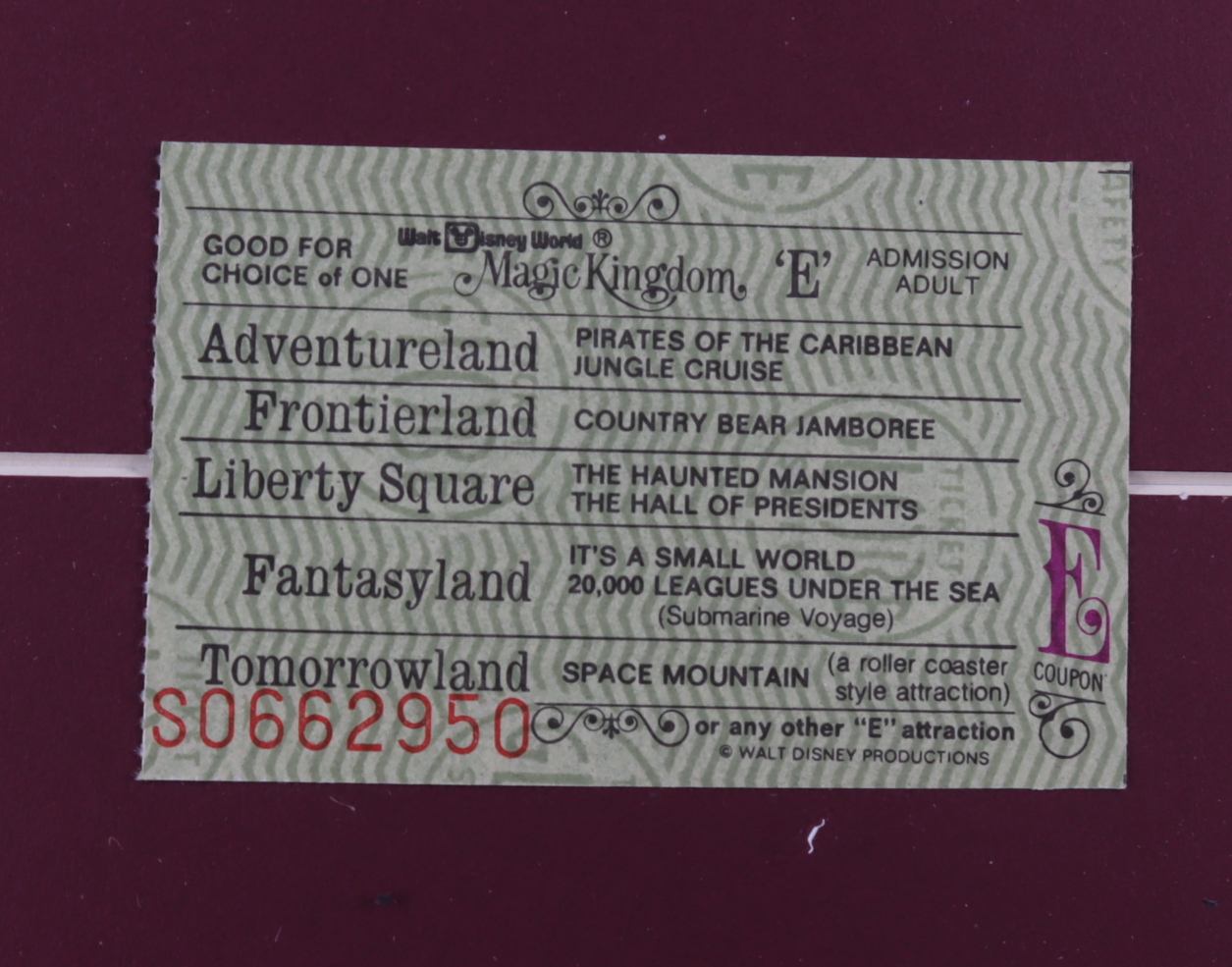 Walt Disney's "Pirates of the Caribbean" 15x25 Custom Framed Print Display with Vintage Disney World "E" Ticket & Official Hanging Pin at PristineAuction.com Walt Disney's "Pirates of the Caribbean" 15x25 Custom Framed Print Display with Vintage Disney World "E" Ticket & Official Hanging Pin at PristineAuction.com