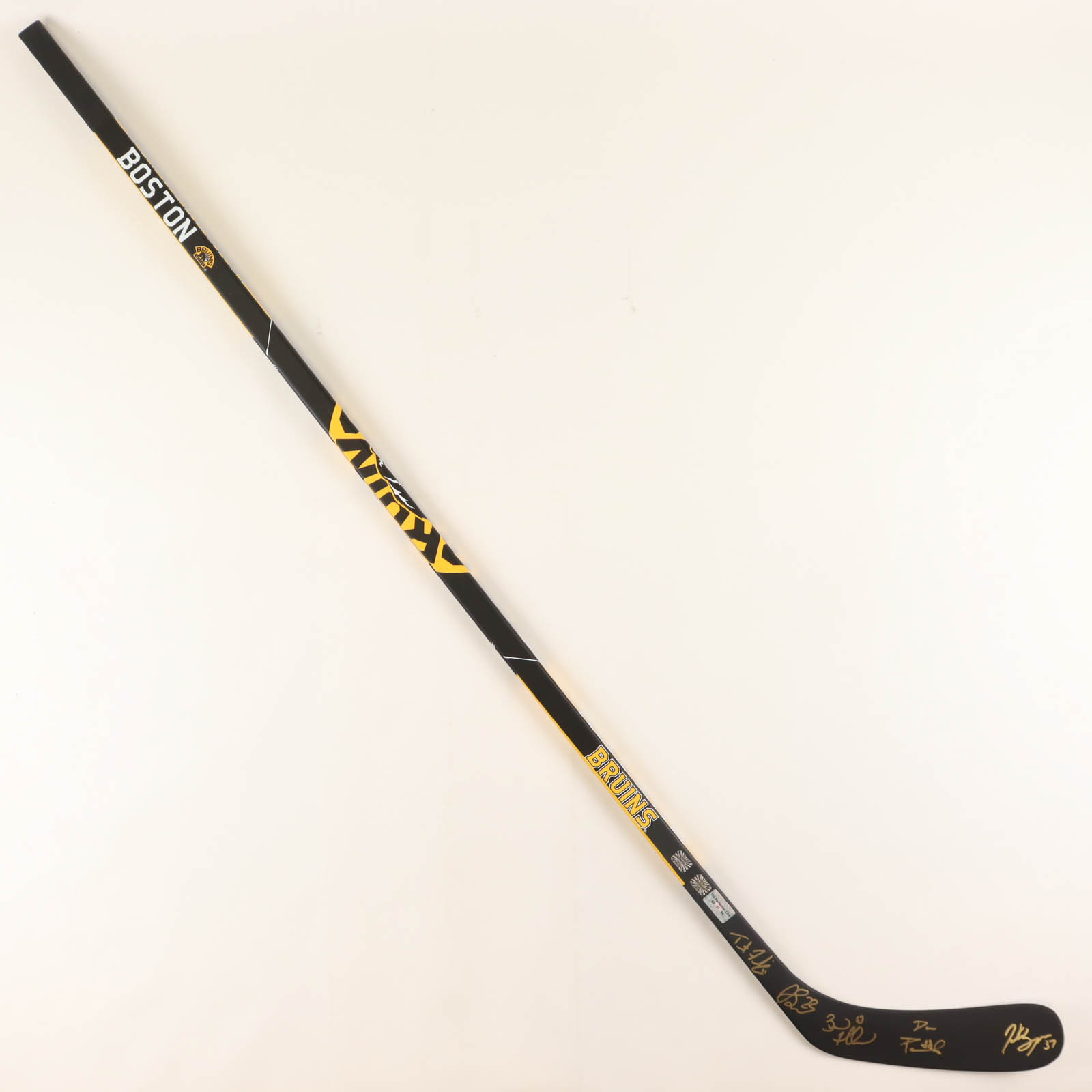 Bruins Logo Hockey Stick Signed by (5) with Brad Marchand, Patrice Bergeron, David Pastrnak, Trent Frederic & Jack Studnicka (YSMS) at PristineAuction.com Bruins Logo Hockey Stick Signed by (5) with Brad Marchand, Patrice Bergeron, David Pastrnak, Trent Frederic & Jack Studnicka (YSMS) at PristineAuction.com